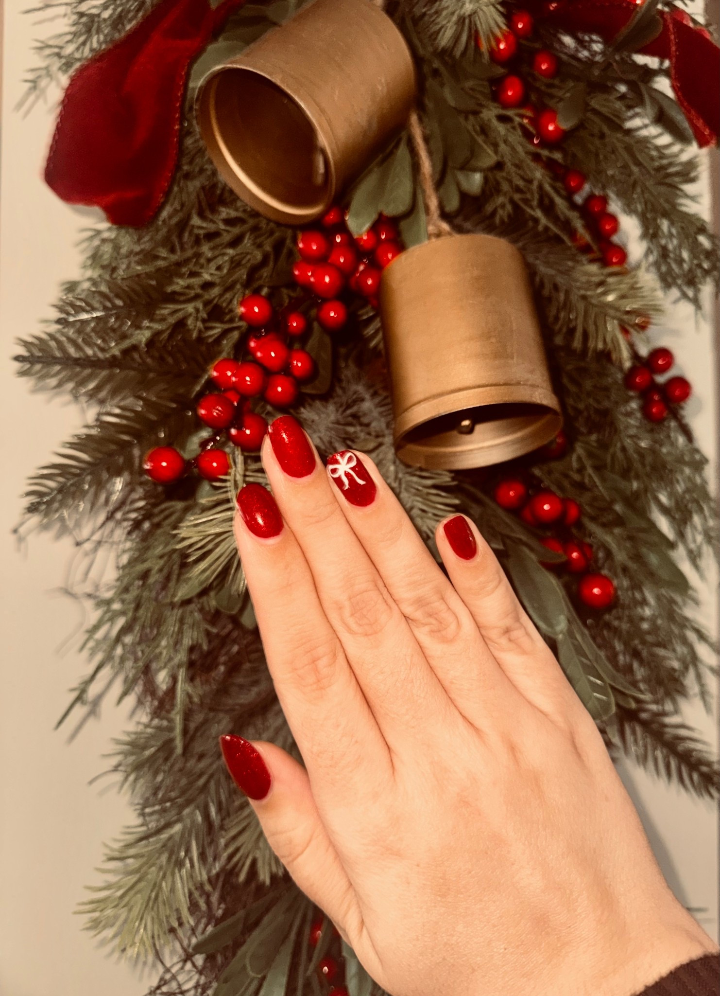 Christmas red bow manicure and bell door swag 😍💅🏼🎄❤️ / Gelish red sparkly nail polish in shade Good Gossip 

#LTKBeauty #LTKHoliday #LTKFindsUnder50