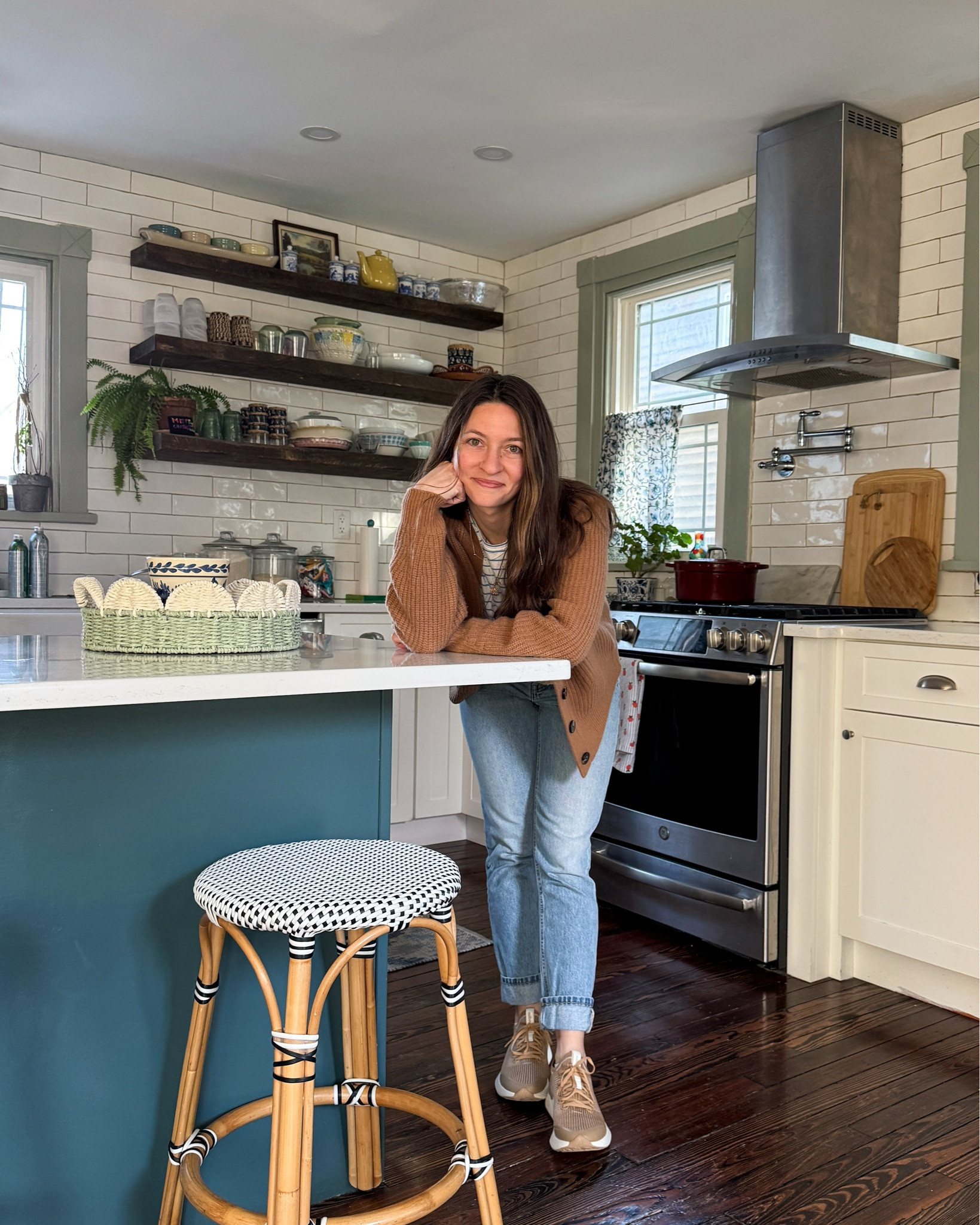 The days my kitchen is clean are few & far between so here it is on a clean day (except only the parts in the photo are clean 😅)! I’m trying to update things in here little by little because it was such an overwhelming job on a short timeline when we renovated it 5 years ago. I still love the white counters & hand cut subway tile (it makes it feel open & clean even when it isn’t!) but painting the peninsula, trim, & adding cafe curtains have made a huge difference. Next up, getting new stools & creating a little coffee nook! Swipe for the original kitchen & when we first renovated! #oldhomes #100yearoldhouse #oldhouses #thisoldhouse 

#LTKHome #LTKFindsUnder100 #LTKSeasonal