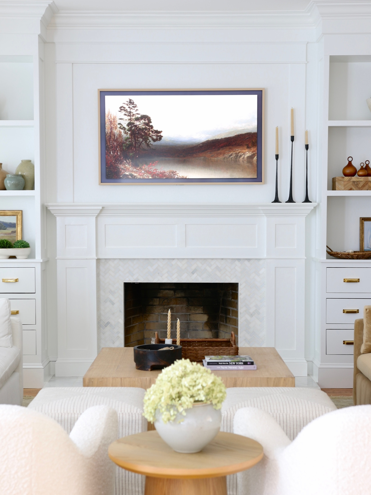 I love this TV! It is a 55” Samsung frame TV with a bezel. The bezel is not required but it really improved the look. The TV comes with a wall mount so nothing else is needed. There is a library of free images. You can also purchase custom TV art.

#LTKhome #LTKFind #LTKstyletip