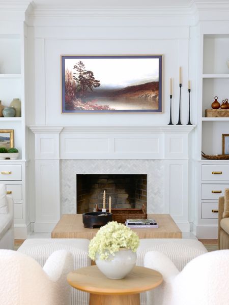 I love this TV! It is a 55” Samsung frame TV with a bezel. The bezel is not required but it really improved the look. The TV comes with a wall mount so nothing else is needed. There is a library of free images. You can also purchase custom TV art.

#LTKhome #LTKFind #LTKstyletip