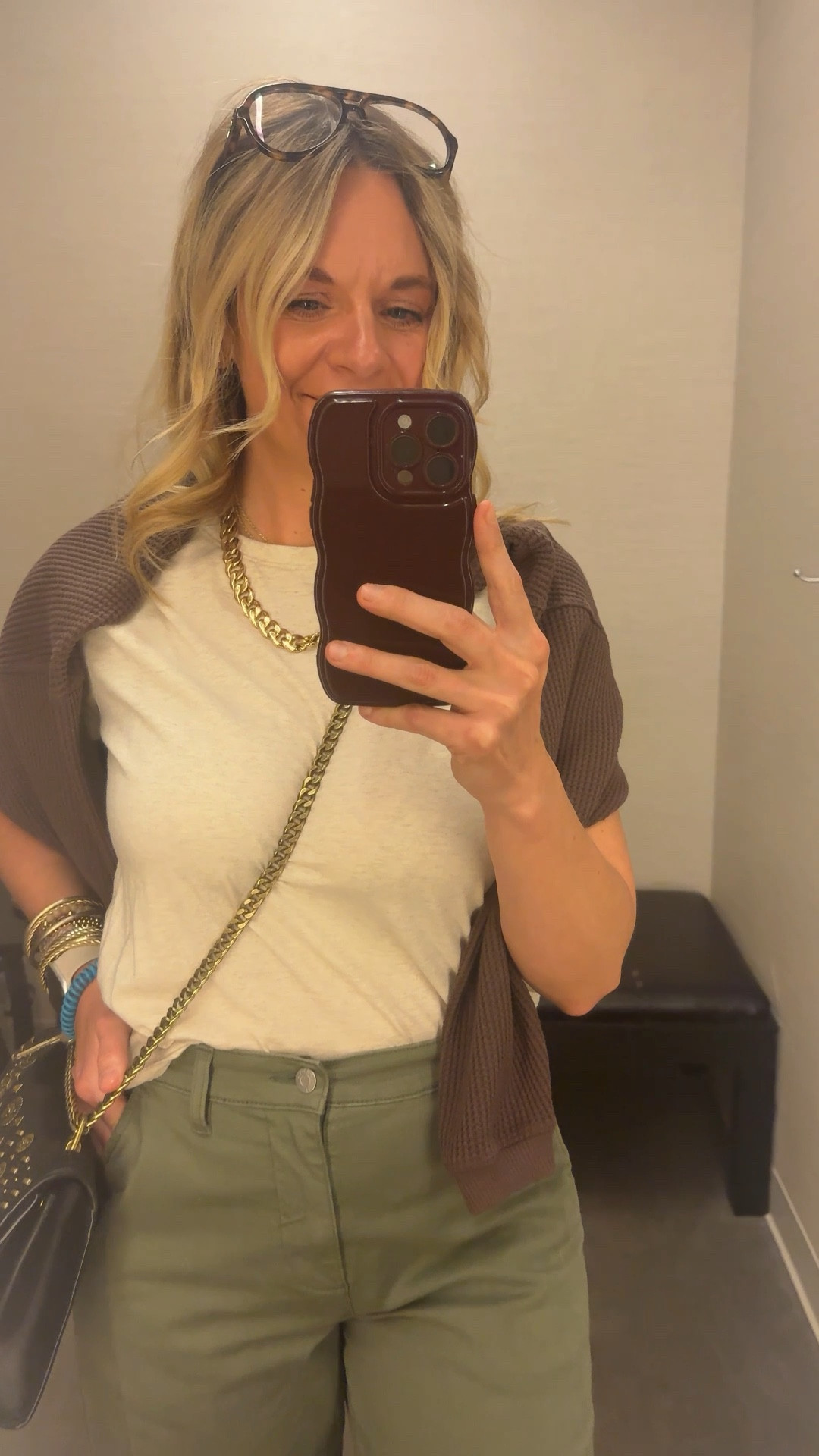 OOTD while setting up a dressing room for a client appointment ✨ Boxy neutral tee + olive barrel pants + brown waffle knit draped over the shoulders + mesh flats + gold accessories. All from my own closet — linked the exact pieces where I can and the closest versions where I can’t. Everything shoppable below! 👇

#LTKootd #LTKdayinmylife #LTKOver40
