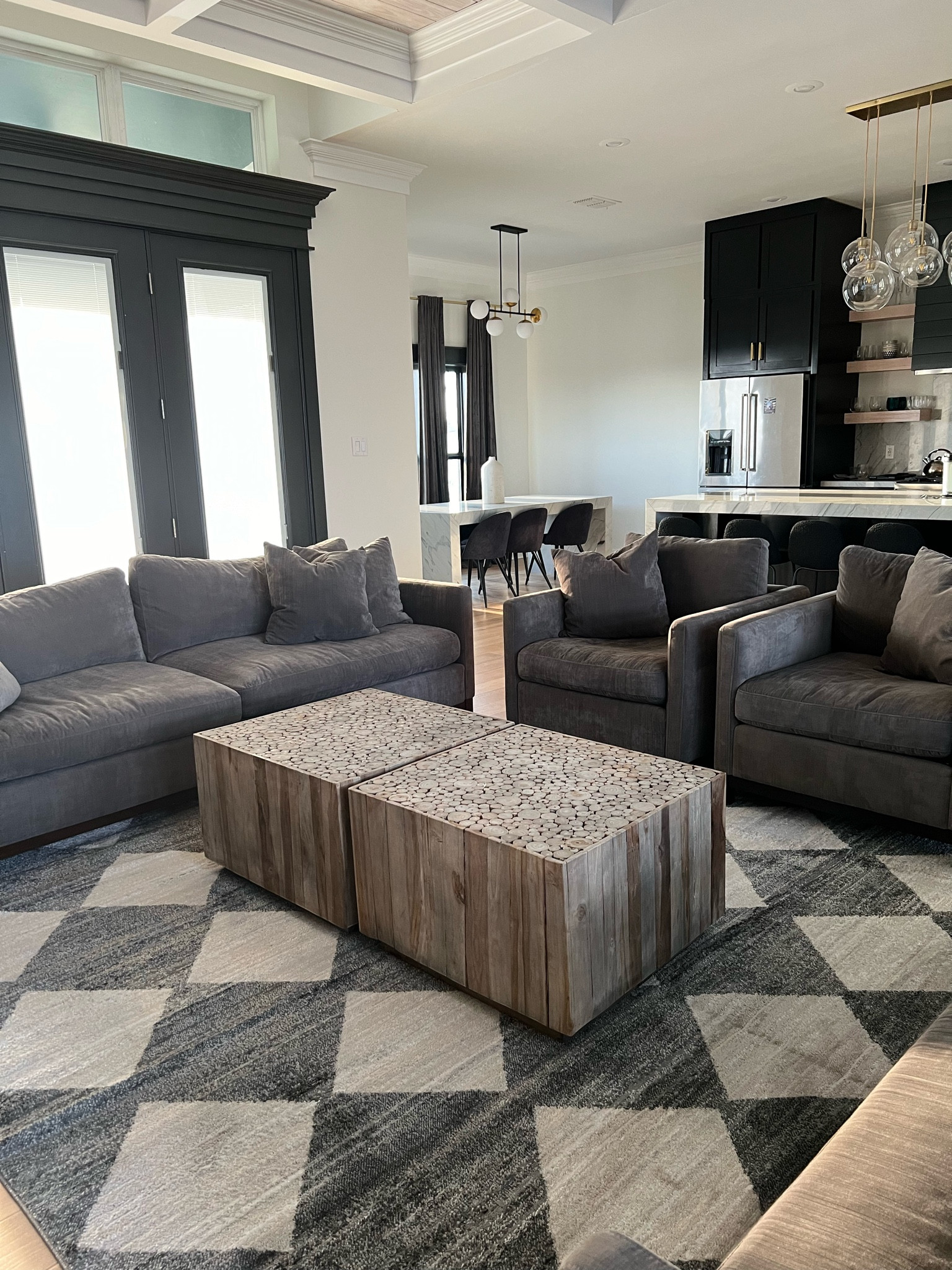 Modern Grey Living Room 

Checkered rug, harlequin rug, diamond rug, area rug, living room, bedroom, dining room, entryway runner, gray couch, coffee table, wood table, wood coffee table, black house, light fixture, chandelier 

#LTKstyletip #LTKfamily #LTKhome