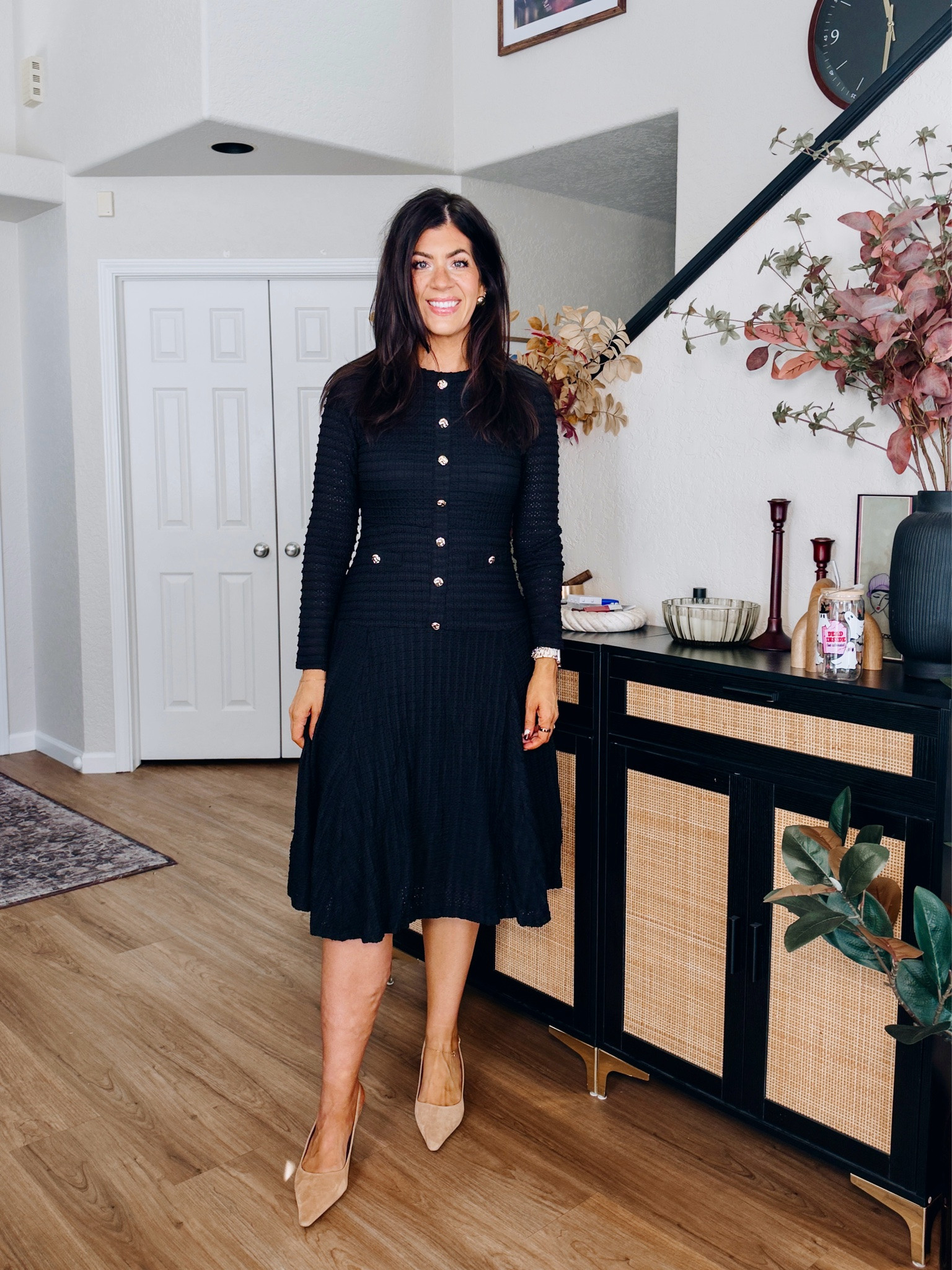 Workwear under $50
In a medium button detail dress