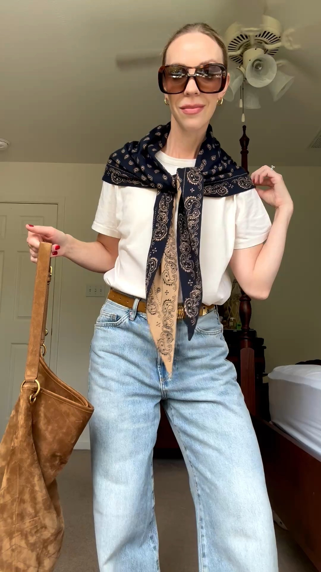 Obsessed with this paisley print bandana scarf - the triangular shape makes styling so effortless

#LTKSeasonal #LTKOver40 #LTKgrwm