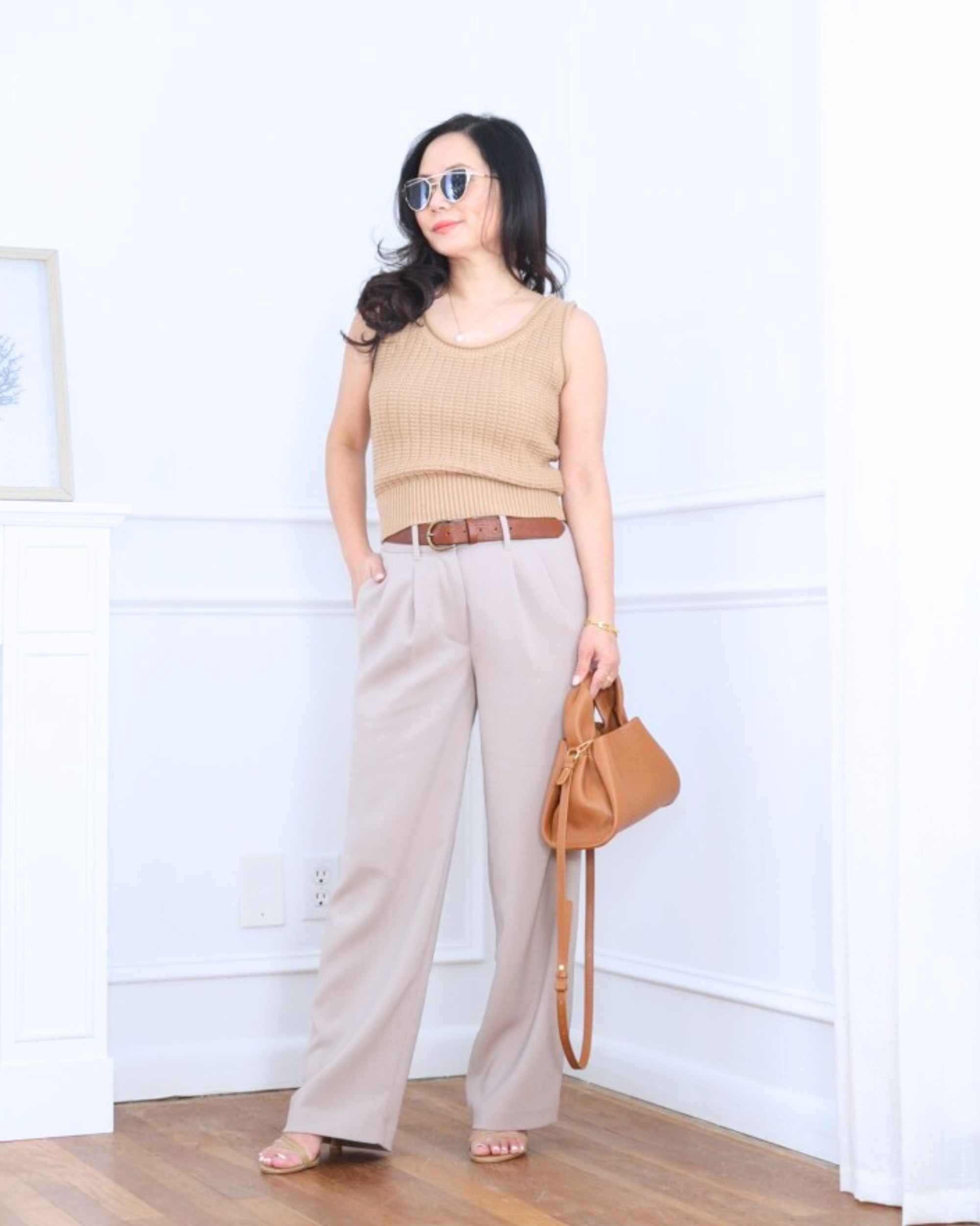 Clean and elevated — a sweater tank paired with crepe pleated pants, both from Quince. Effortless, polished, and perfect for days when you want comfort with a tailored feel. I’m 5’2, wearing size XS.

#LTKPetite #LTKootd #LTKOver40