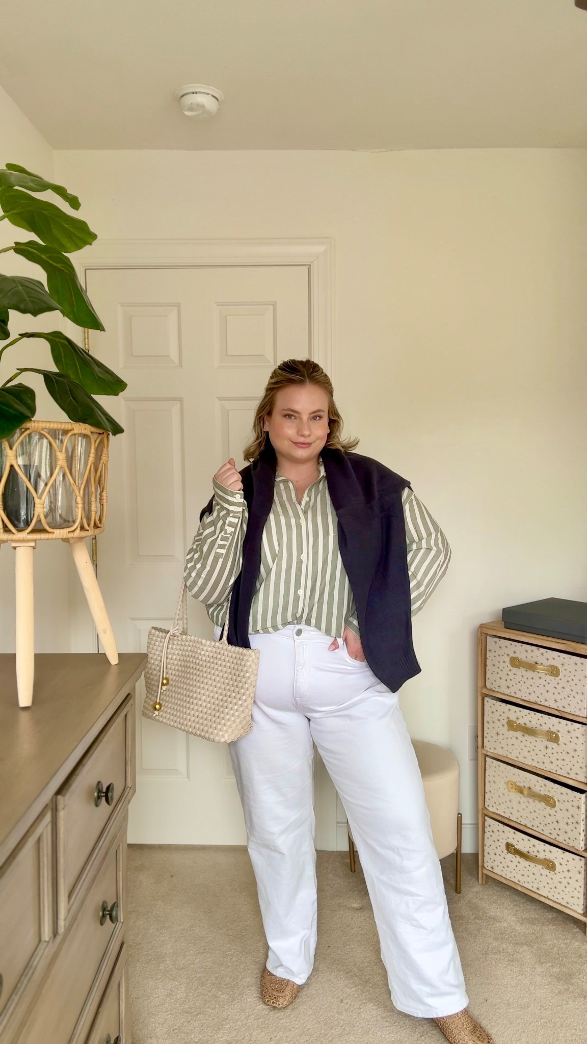 A classic striped button-down with white denim 🤍 I paired this @Torrid  white jean with a green striped shirt and added a navy sweater layer for that effortless, polished feel. Finished with neutral woven accessories to keep the look light and timeless for spring.

plus size work outfit • striped button down outfit • white denim outfit • Torrid outfit • spring work outfit • curvy fashion • classic spring style

#LTKSeasonal #LTKootd #LTKPlusSize