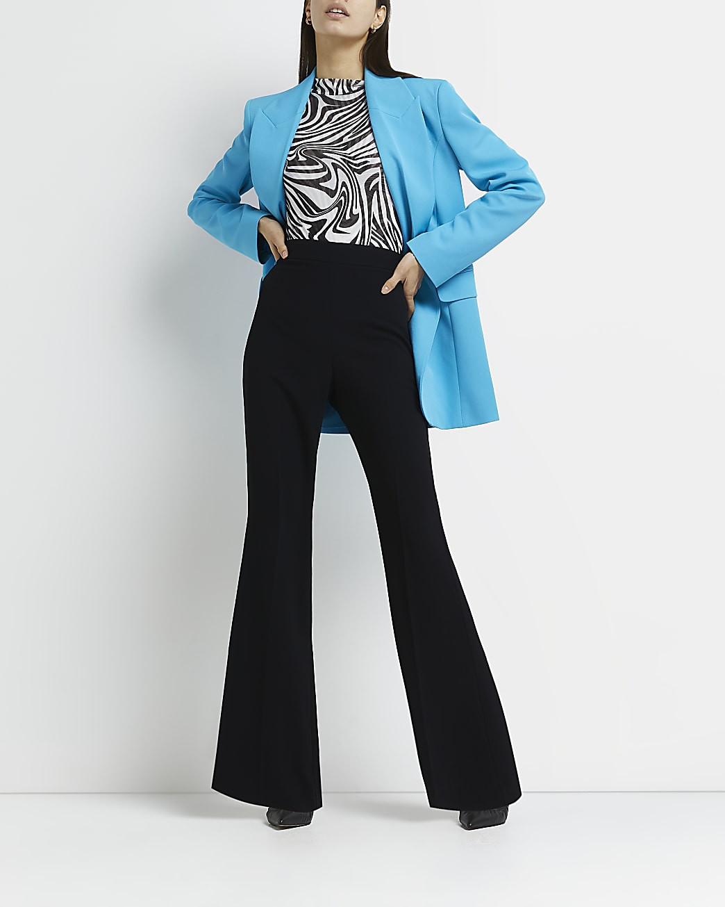Black high waisted flared trousers | River Island (UK & IE)