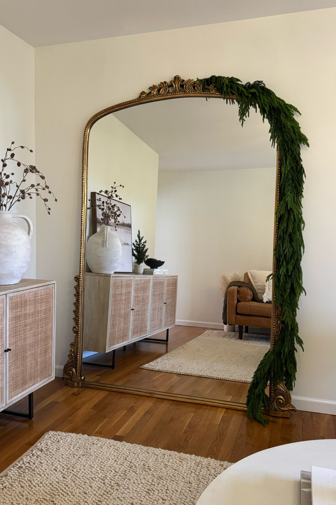 Norfolk Pine Natural Touch Garland sells out SO FAST every year! I use this all around the house - mantle, sideboards, railing, mirrror. I have five 5’ pieces layered here and usually recommend 3-4 for a sideboard or buffet, 5 for a mantle and I like a few of the 15’ for the staircase railing! It’s really about the look you want. The more you layer, the fuller it appears. This stuff is truly the BEST! I store it in a wreath holder off season. 

Pine garland, real touch garland, Norfolk pine, holiday decor, holiday greenery, Christmas decor, winter decor

#LTKHome #LTKSeasonal