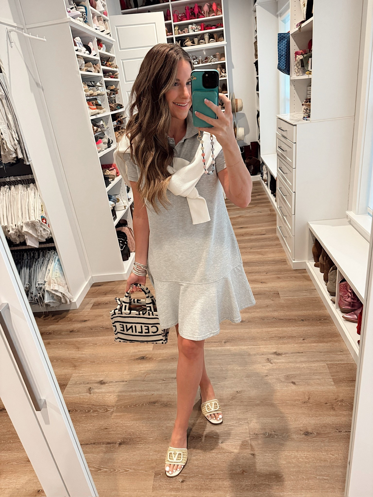 In a medium ruffle bottom polo shirt dress, medium sweater, slides and accessories- fits tts.

#LTKFindsUnder50 #LTKSeasonal #LTKStyleTip