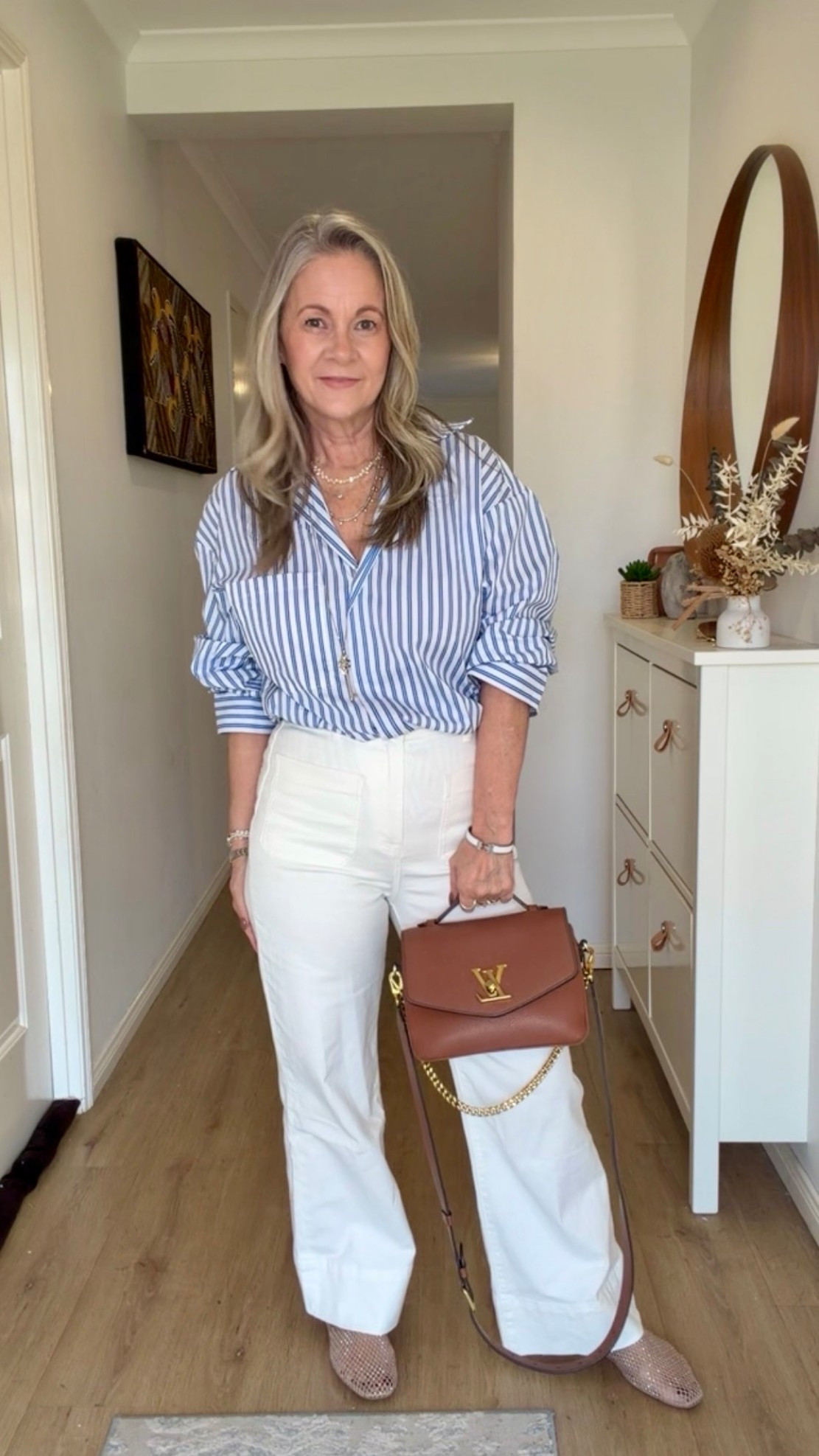 Yes… another striped shirt. Apparently, I have a type. 😂

I’ve paired this one with white jeans and tan accessories for a fresh, summery feel. And before anyone says, “But it’s winter!”… I live in Queensland. Sunny, mild days mean this outfit still gets plenty of wear.

Shirt is very oversized - I went down to a sz 4, I would usually be a sz 10.