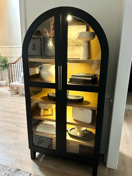Can you believe this arched cabinet is only $398?! 🤩

It’s a beauty, but I didn’t love the handles that it came with, so I changed them out to these beautiful affordable brass ones I found on Amazon and elevated the look even further with rechargeable battery operated puck lights, also from Amazon!

I shared this cabinet last week -  It keeps coming in and out of stock - so the best thing to do is keep checking if this is a piece you have your eye on.  You can always save this post and come back to it for reference too! 

It comes in an oak color as well, and the scale is so good! 36 in W x 16.375 in D x 72.25 in H - so very similar to other designer options that are 5-10x this price!

It’s does not come assembled, so prepare to take time to assemble, but it’s so worth it as it’s a nice and sturdy and looks so high end!

This spot in my dining room was the perfect spot for it, and I’m loving how it compliments my other black accents in my space - and now love it even more with the extra touches I made! 



Like, save, and share and follow along for more home design and DIY @johnston.designs_ 

#homedesign #homestyle #homestyling #interiordesign #walmarthome #walmartfinds #archedcabinet #cabinet #cabinetstyling #affordablehomedecor #homedecor #homestyling  #neutralhome #myneutralhome #homedecorating #homedecorfinds #livingroomdecor #livingroom #bedroomdecor #diningroomdecor #organicmodern #modernorganic #ltkhome

#LTKhome #LTKsalealert