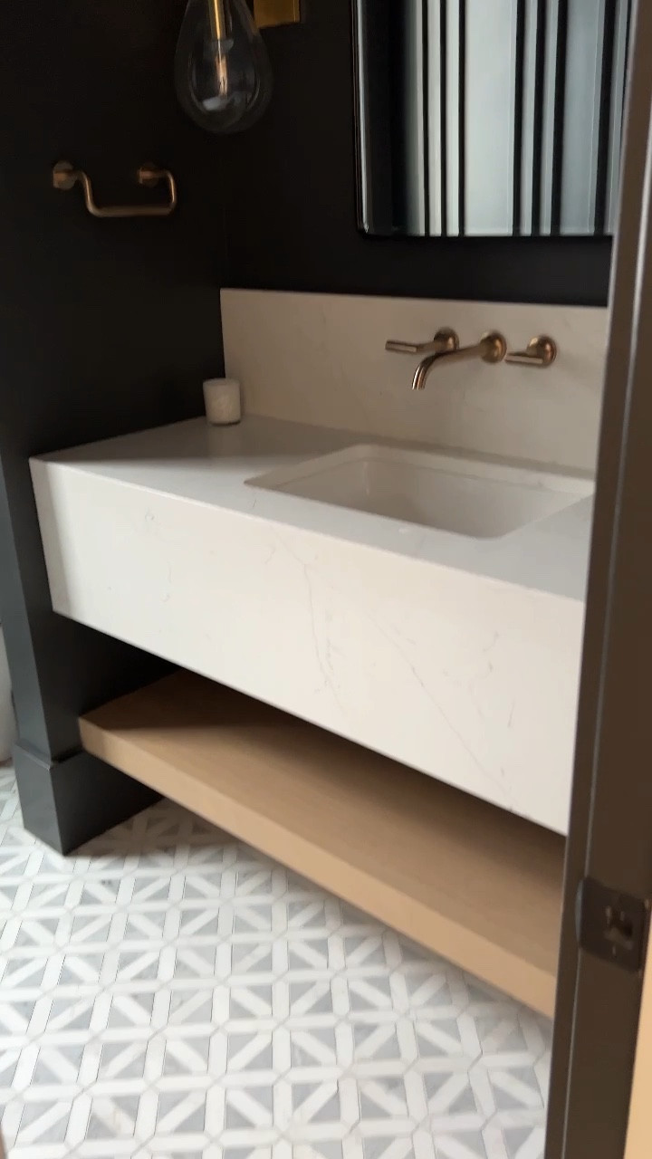 Sharing details on our powder bathroom! I wanted this room to feel like a high class hotel! The paint color is Iron Ore and we took it to the ceiling and baseboards. 

#LTKstyletip #LTKFind #LTKhome