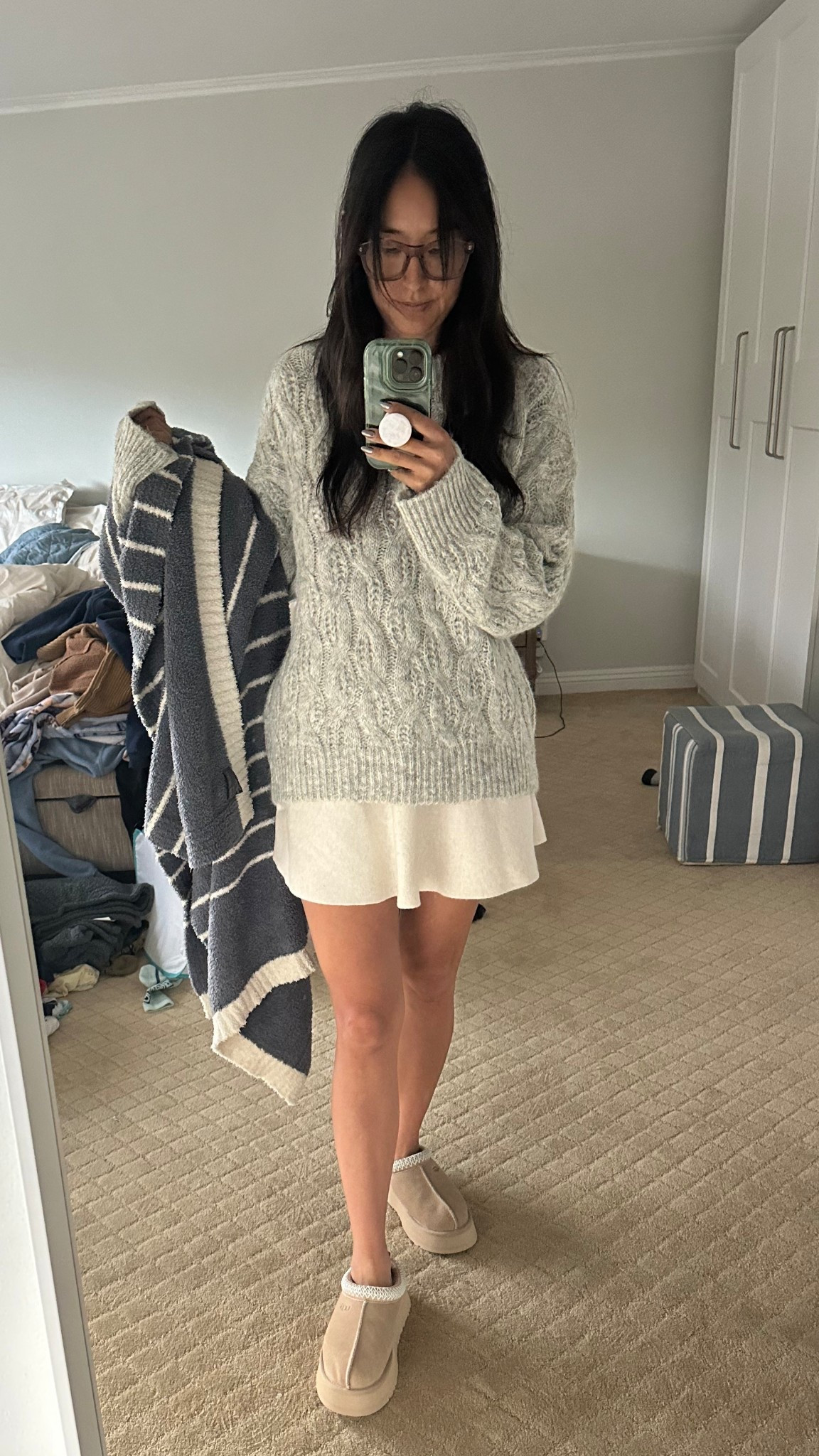 Ignore the massive pile of unfolded laundry I am getting to it.

These are my work from home companies. I am loving this skirt. It’s made from the same material as my midi skirt that’s wrapped around. This sweater is so soft and I got it in a medium so that it’s oversized.

#LTKdayinmylife #LTKCyberWeek #LTKootd