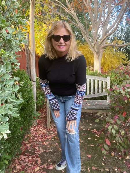 Back again! This cute thermal sold out last year. Lots of compliments. Layer under a vest so the fun sleeves show or on its own. Mock turtleneck adds warmth. Runs TTS. I’m wearing medium which is sold out in black. A vneck version is available. I’m grabbing a vnecks style in red. 

#LTKstyletip #LTKGiftGuide #LTKSeasonal