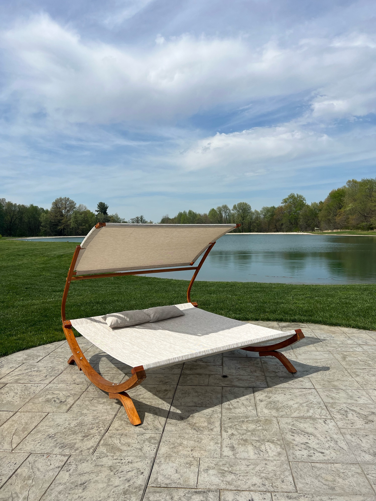 Double lounge outdoor canopy daybed, with curved weather-resistant teak base. So comfortable! Perfect for pool or backyard patio. #wayfair 

#LTKhome #LTKswim #LTKSeasonal