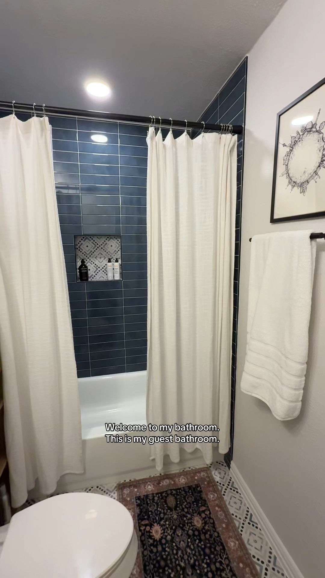 Guest bath glow-up ✨
Swapping a plastic liner for fabric shower curtains instantly elevated the space. I layered two panels so they open in the middle — hotel-style and way more intentional.

The soft cotton texture balances the tile accents, adds movement, and makes the whole bathroom feel warmer and more finished. Small design choices really do the heavy lifting.

Linked similar curtains + bathroom details I’m loving 

#LTKFindsUnder100 #LTKFindsUnder50 #LTKHome
