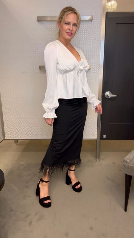 What’s black & white and has feathers? THIS pretty outfit. The black pencil skirt has a feather trimmed hem. The stunning cream blouse has a rosette at the bustline. Platform sandals are made to party. Pssst… this outfit is from Nordstrom and it’s a steal! 

#LTKshoecrush #LTKover40 #LTKVideo