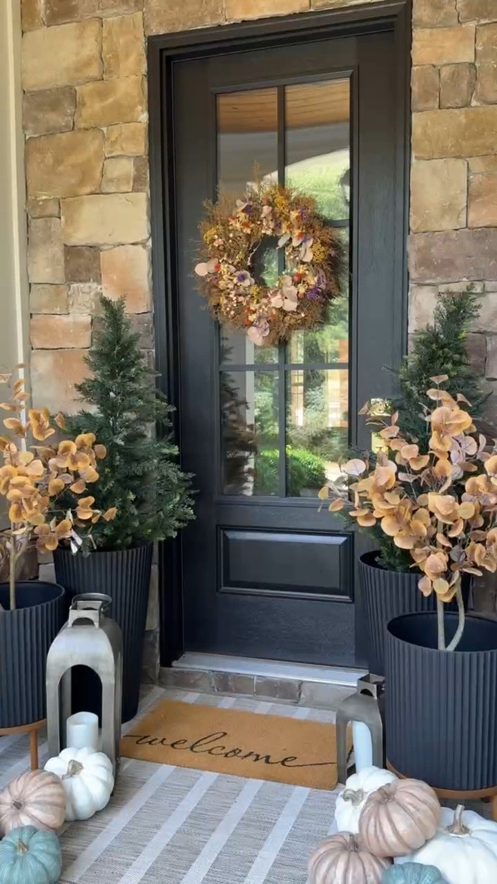 Our fall porch 🍂 These faux autumn eucalyptus trees are my favorite for the season and to be able to pull them out each year is so nice!

#LTKSeasonal #LTKHome #LTKHalloween