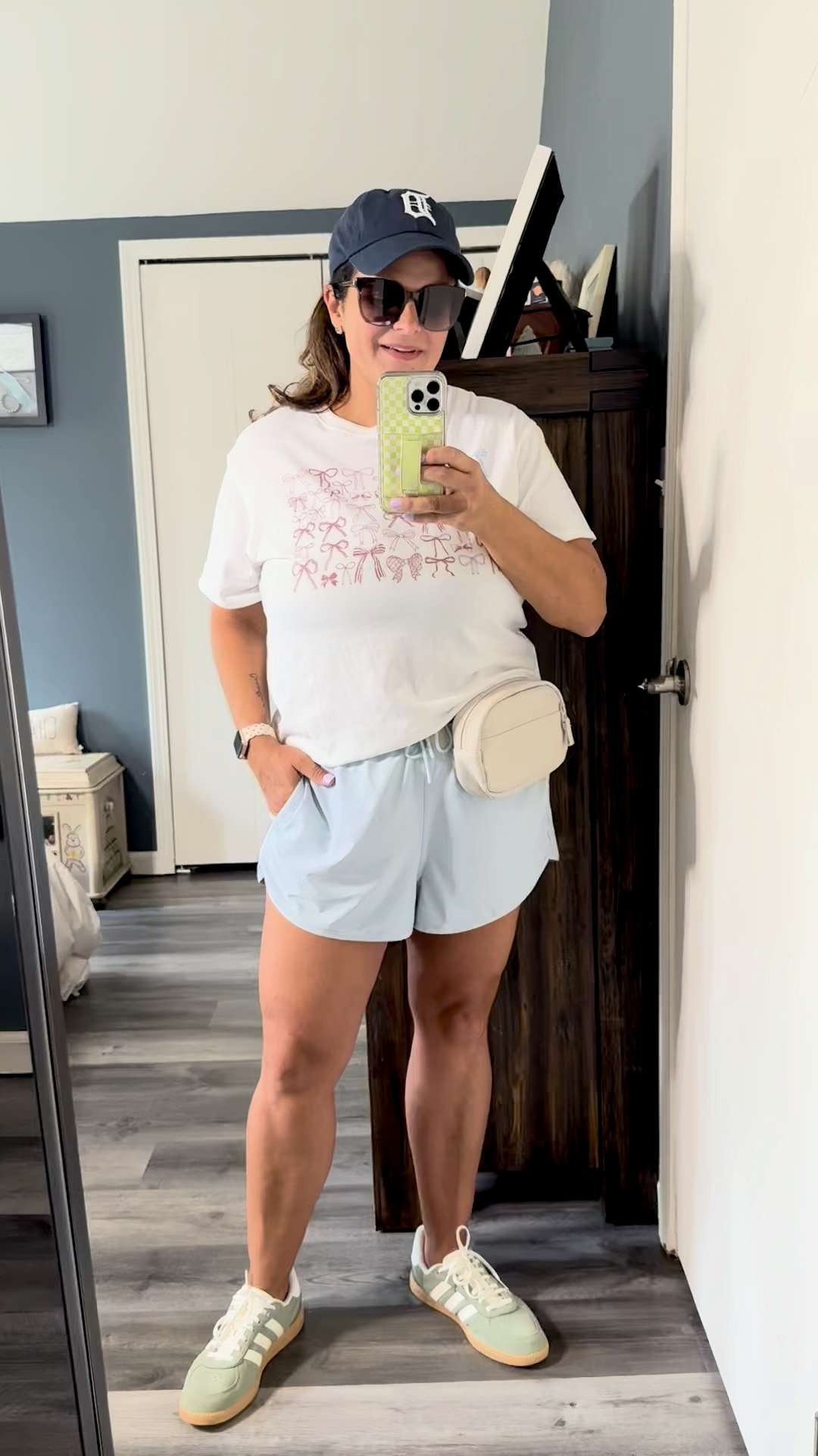 #ad Memorial Day Weekend ball field outfit ⚾️☀️
Wearing my new Kohl’s finds on repeat lately — comfy FLX shorts, adidas sneakers, Tigers hat, belt bag for all the mom essentials, and the cutest bow flag graphic tee for the weekend. Added the little patriotic heart earrings for a fun touch too.
This is basically my summer baseball mom uniform: comfy, easy, and cute enough to wear beyond the ball fields.
Kohl’s has SO many good summer finds right now and the sales are really good too.
#kohls #kohlspartner @kohls @laurenconradco Memorial Day weekend outfit, bow flag tee, baseball mom outfit, athletic shorts, adidas sneakers, belt bag, Tigers hat, summer style, casual mom outfit, ball field style
 

 #LTKootd #LTKActive #LTKMidsize