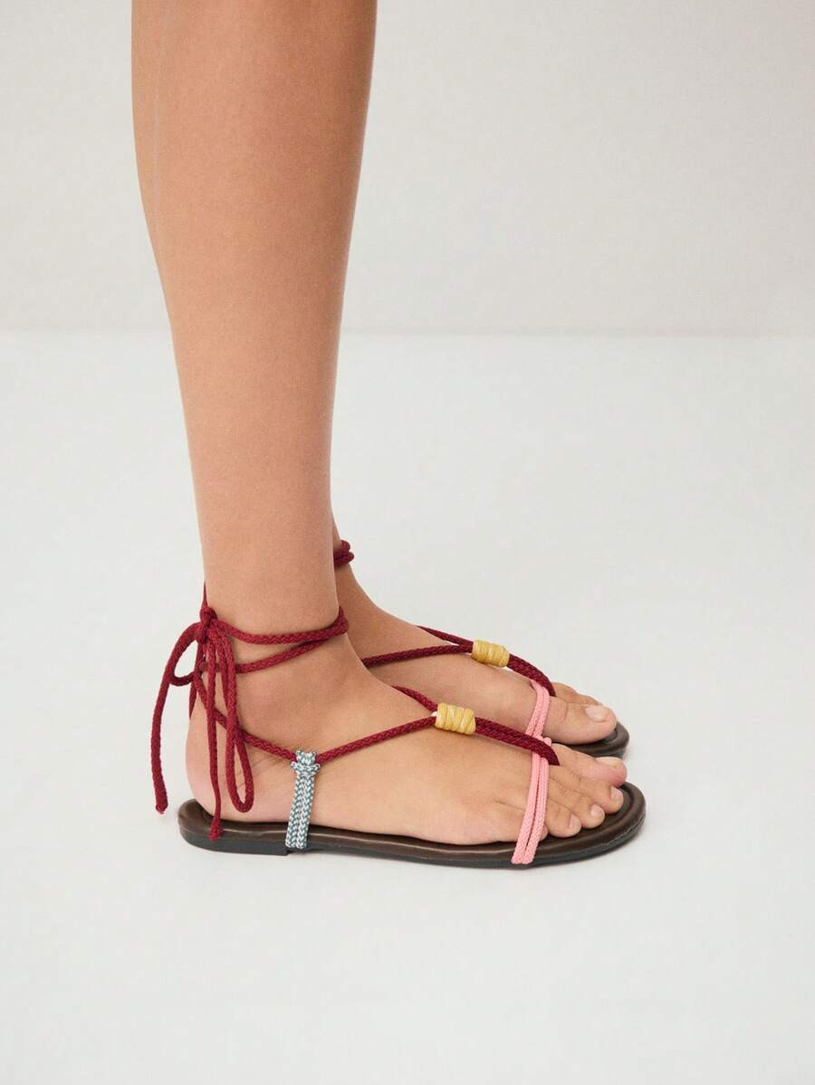 Nöista A Unique Flat Sandal Featuring Multicolored Rope Straps With A Wrap-Around Lace-Up Design... | SHEIN