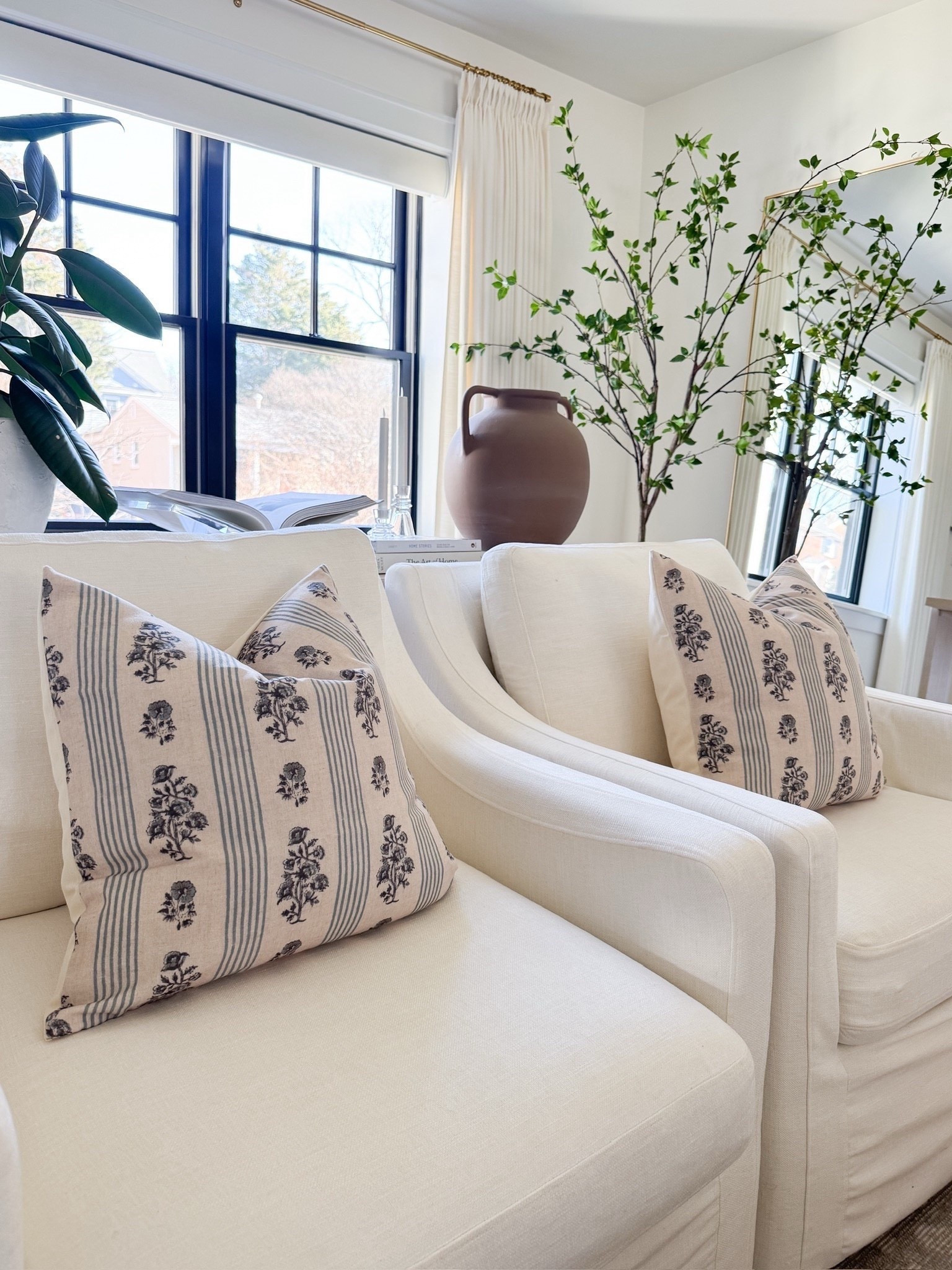 Neutral living room with pips of green. Round light wood coffee table. Home refresh inspo. 

#LTKdayinmylife #LTKHome #LTKSeasonal