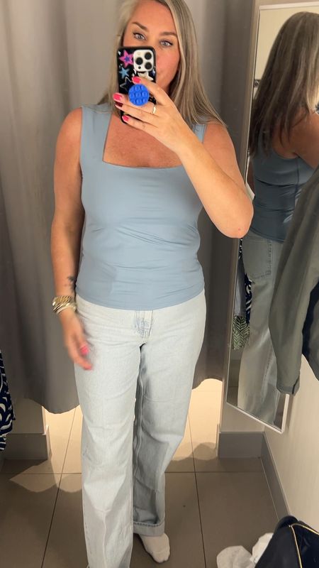 H&M try on. Dusty blue top with square neckline and wide straps. Fits tts. I am wearing a large. Super long jeans in a light blue wash. Perfect for spring. No stretch, so size up. I am wearing a 44. 



#LTKstyletip #LTKover40 #LTKmidsize