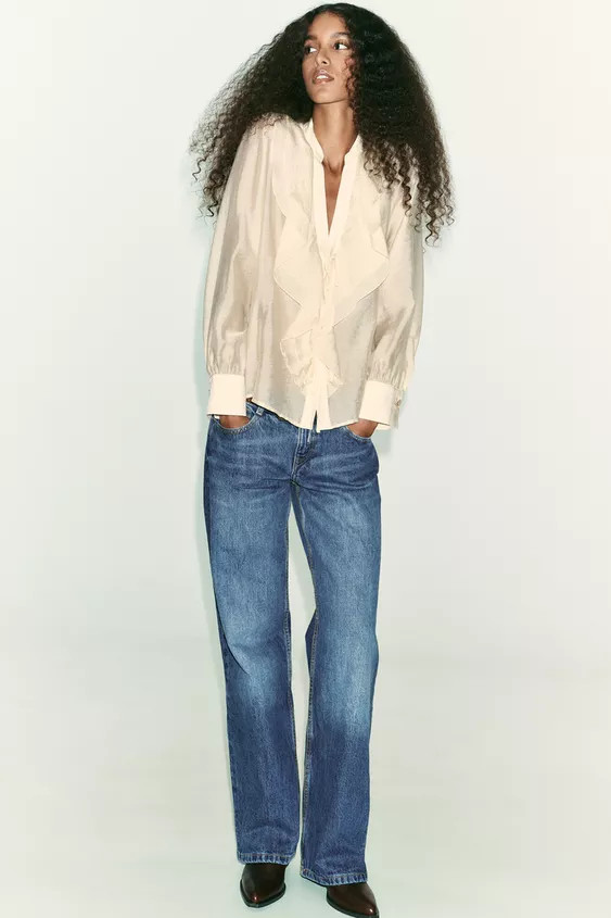 Round neck blouse with V-neckline with ruffles and long sleeves. Front tie closure.Beige | 6962/2... | Zara US