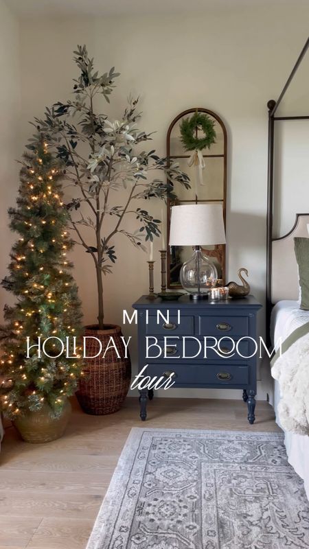 Holiday bedroom tour featuring our king canopy bed, black nightstands, arched wall mirror, bedding, rug, faux trees, dresser, floor mirror & lighting!

#LTKsalealert #LTKstyletip #LTKhome