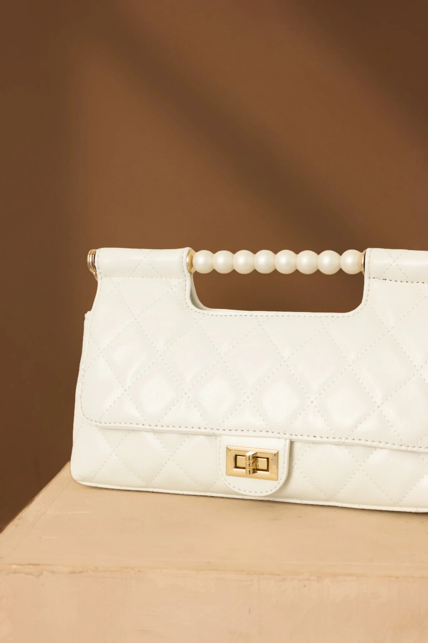 Handled It Beautifully White Quilted Pearl Handle Handbag | Red Dress