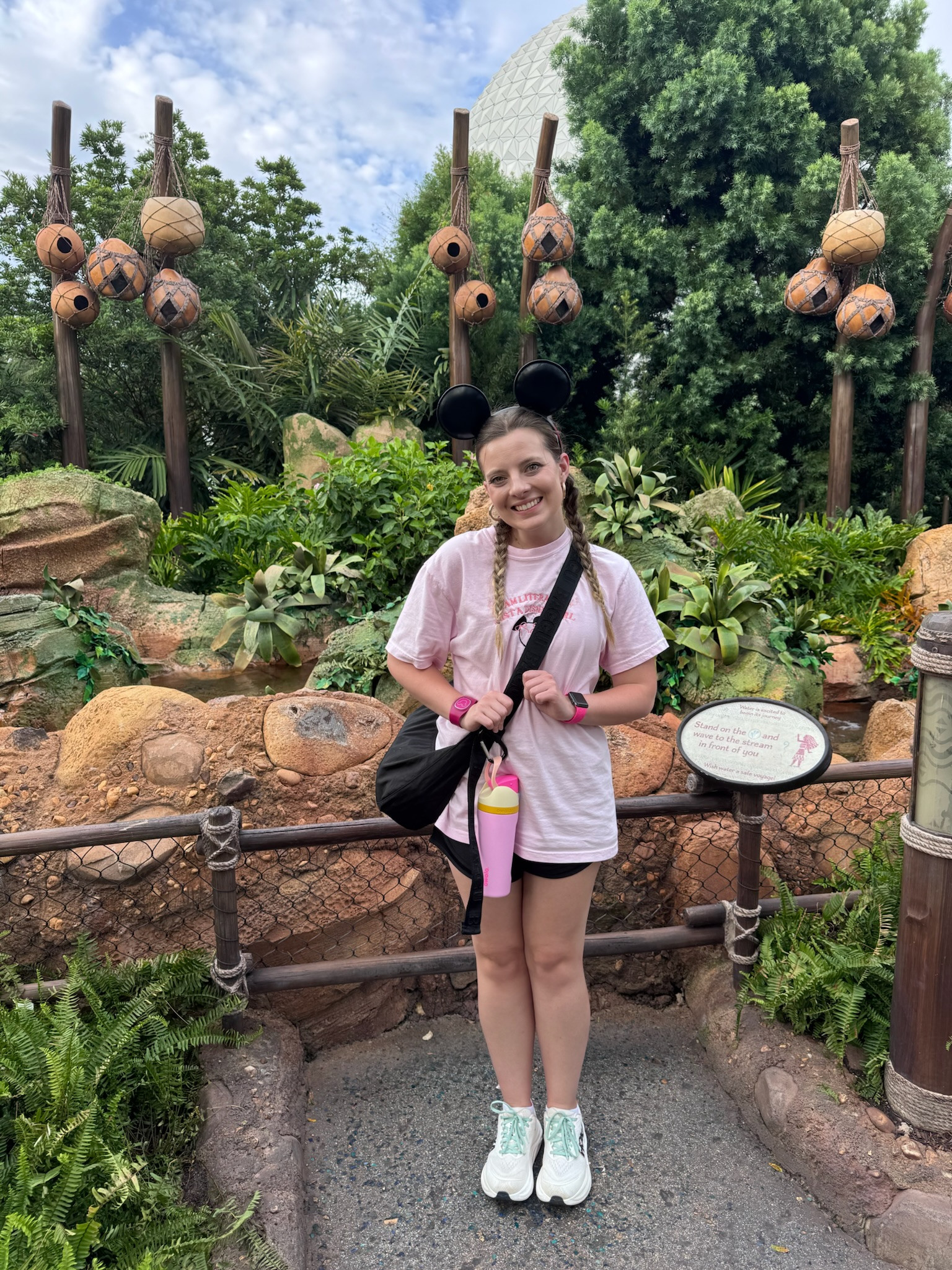 My favorite pink Just a Disney Girl tee is perfect for park days! So soft and breathable even in the Florida heat. Classic black Mickey ears and black athletic shorts keep it simple and comfortable for walking miles around Epcot. I always wear sneakers with good support - these white and mint ones are so cute and keep my feet happy all day. Don't forget the crossbody bag for park essentials and a water bottle to stay hydrated!

#DisneyParkOutfit #EpcotOutfit #DisneyWorldStyle #ComfortableDisneyOutfit #DisneyParkEssentials #BlackMickey Ears #ParkDayOutfit #DisneyShorts 

 #LTKootd #LTKActive #LTKTravel
