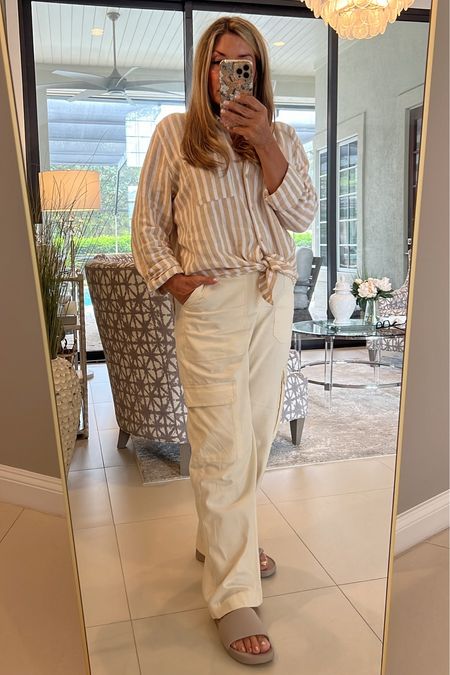 These off-white cargo pants are 20% off right now. And I love this striped linen shirt. I find myself reaching for it all the time. Summer outfit. Spring outfit. Vacation outfit.

#LTKSaleAlert #LTKOver40 #LTKFindsUnder50