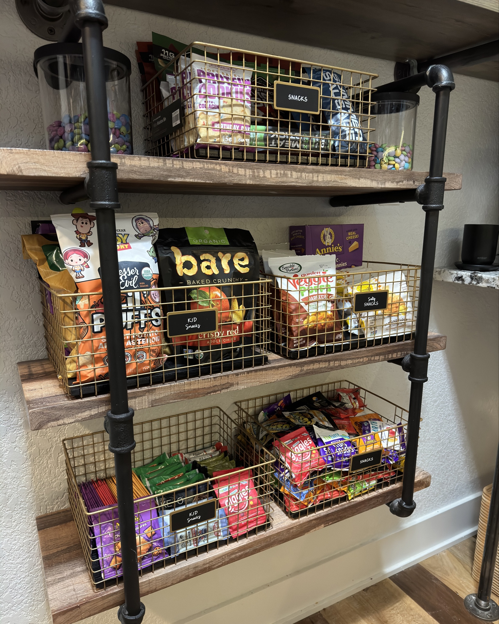 Has your snack area of your pantry ever looked THIS good?! Adult snacks up top and kids snacks at their level so they have that independence of getting into them on their own- plus these grid bins are gorgeous AND you can see everything in them ✨ #LTKOrganized #LTKpantry 

#LTKkids #LTKstyletip