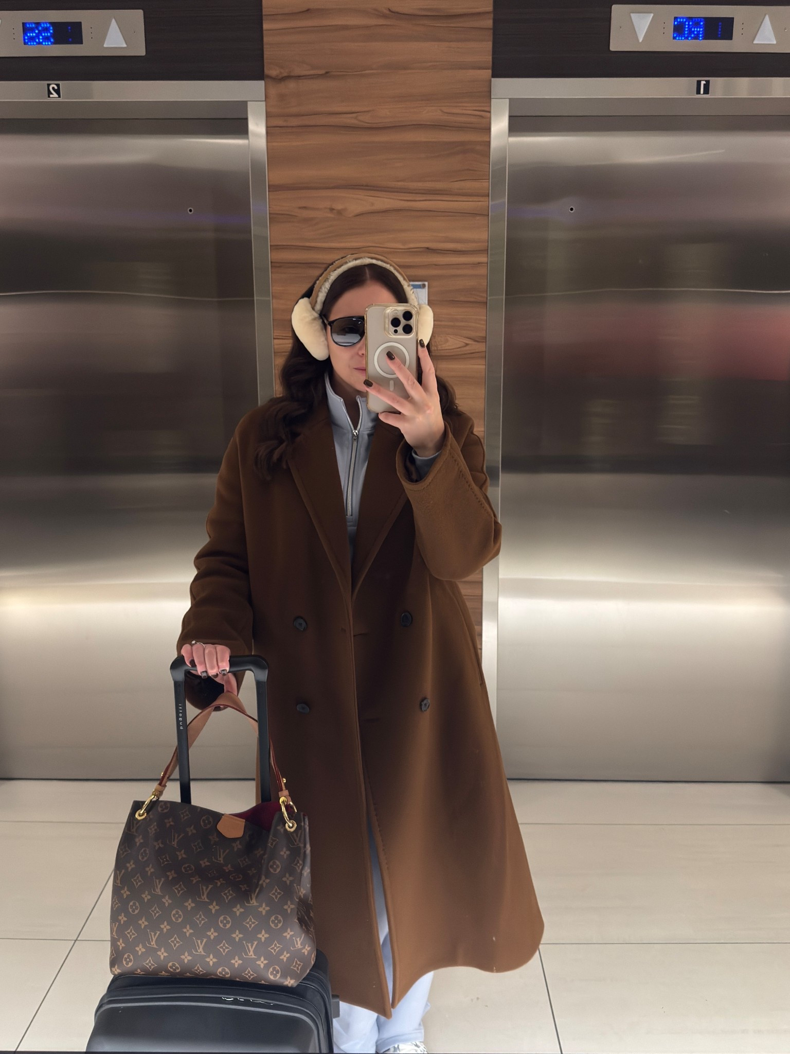 Travel Day Fit — Winter Edition 🤎

Cold-weather layers for a long-haul flight: wool camel coat, fleece zip-up, wide-leg lounge set, earmuffs, oversized sunglasses, and a classic LV tote.
Linked exact + similar winter travel essentials

#LTKtravel #LTKwinter #airportoutfit #traveldayfit #winteroutfit #neutralstyle #camelcoat #winterlayers #travelstyle #coldweatheroutfit #LTKfashion #LTKcanada
