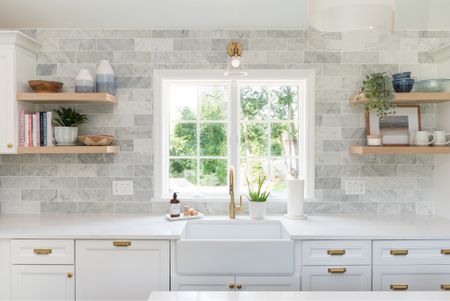 Bright white coastal style kitchen with white cabinets, brass fixtures, large farmhouse sink, coastal style home decor

#LTKFamily #LTKHome