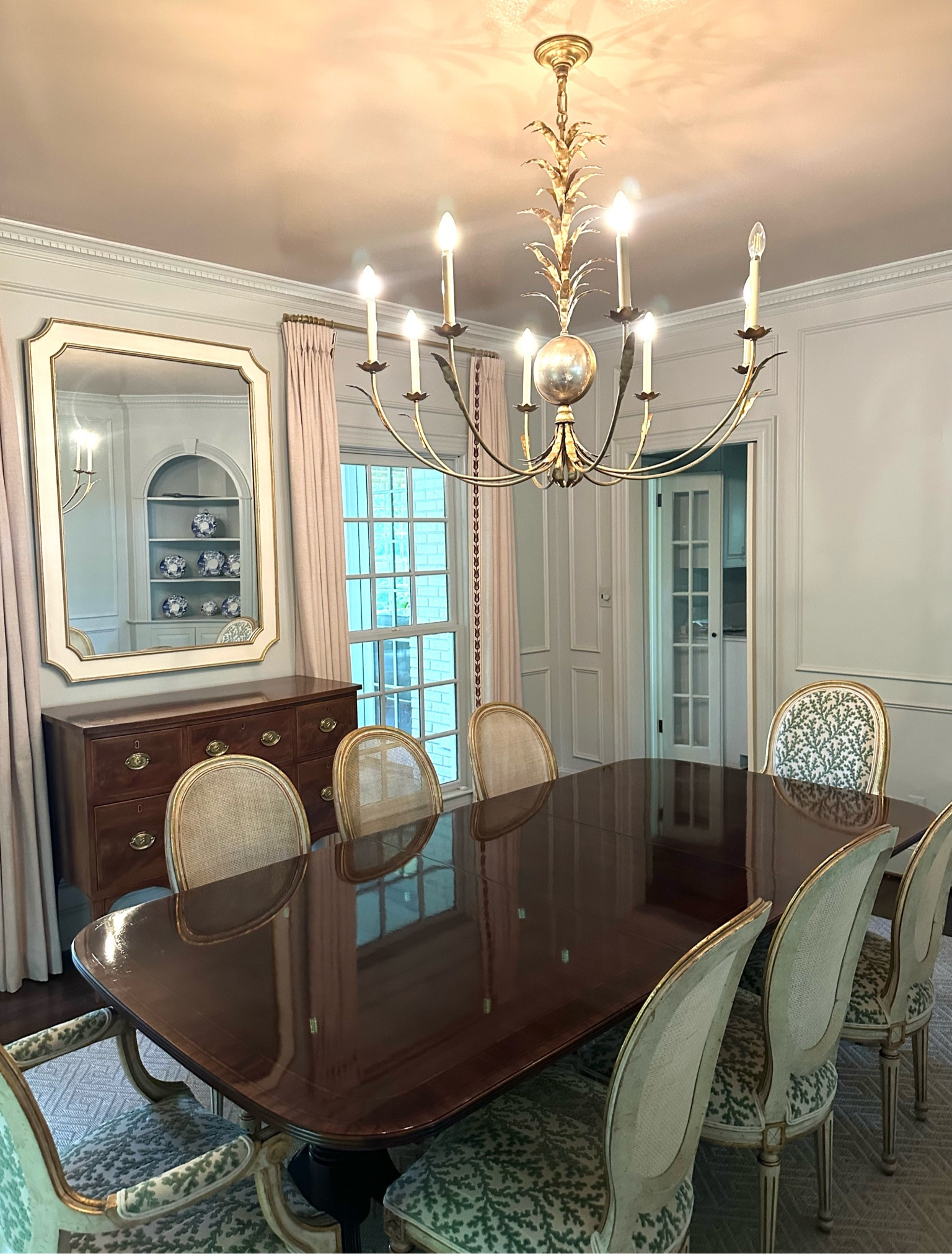 The chandelier of my dreams! I was looking for an updated, traditional and large light to fill the room and make a statement. I love how it reflects off the glossy ceiling and antique table! 