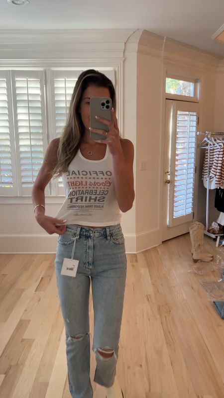Country concert outfit idea. I love this tank and these jeans. I’m wearing a size small in the tank and I did my true size 26 in the jeans. I feel like these jeans are very elongating. I am 5’10! I personally feel like they would look best on someone 5’8 or shorter! They really are a great fit and so flattering!!! 

#LTKstyletip #LTKVideo #LTKshoecrush