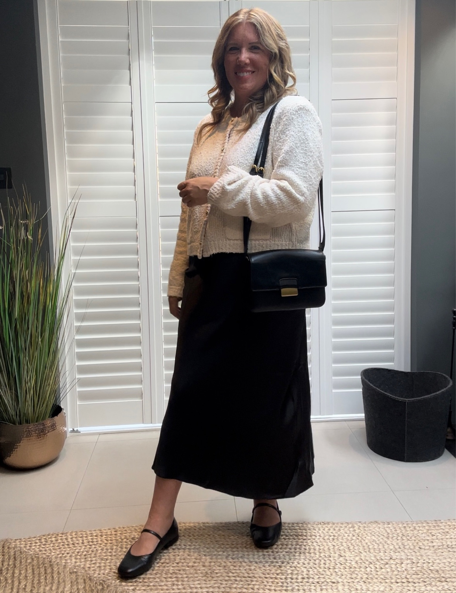 Black satin midi skirt, boucle cardigan, Mary Jane shoes 

#LTKover40 #LTKshoecrush #LTKSeasonal