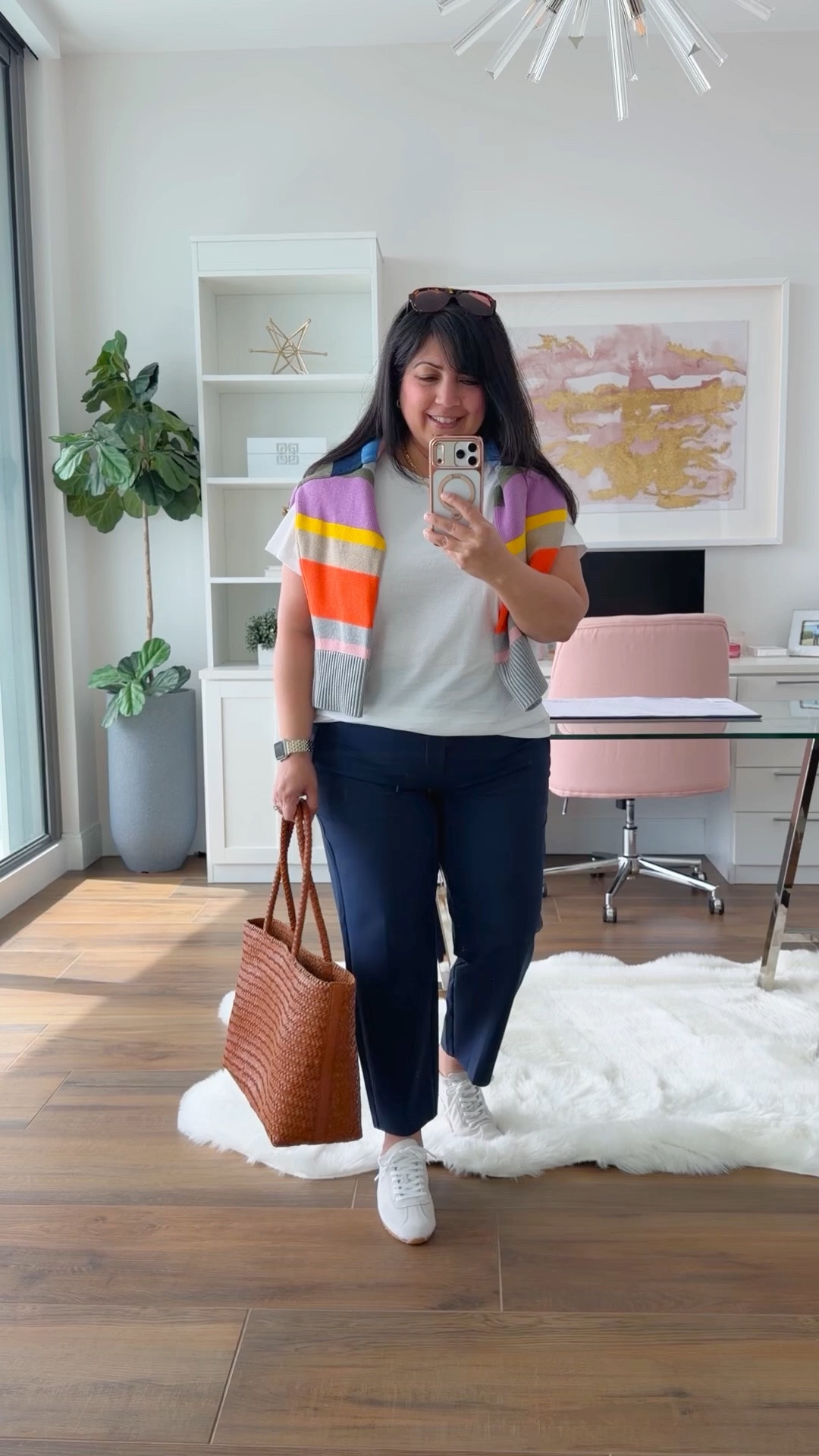 Spring outfits 2026! Layering outfits are great in the spring when the temperature fluctuates throughout the day. Love this easy casual everyday outfit that can be worn as a travel outfit or even business casual workwear. Wear the sweater when it’s cooler or throw it over your shoulders as the day warms up. Aren’t the colors in this cotton crewneck sweater so bright, fun and happy?! Love the color combo!  Paired it with these amazing pants from Athleta and a cute pair of low profile sneakers. Added this woven tote bag which is great for everyday wear and makes a really nice work bag too that can hold your laptop and any other work related items. 

Boden striped sweater size large. Athleta white tee size XL. Athleta navy pants size 12 Petite. Dolce Vita sneakers. If in between sizes, size up. Madewell woven tote bag. 

Spring outfits 2026, summer outfits, work outfits, business casual workwear, weekend outfit, work from home outfit, casual everyday outfit, travel outfit 

#LTKOver40 #LTKPetite #LTKMidsize