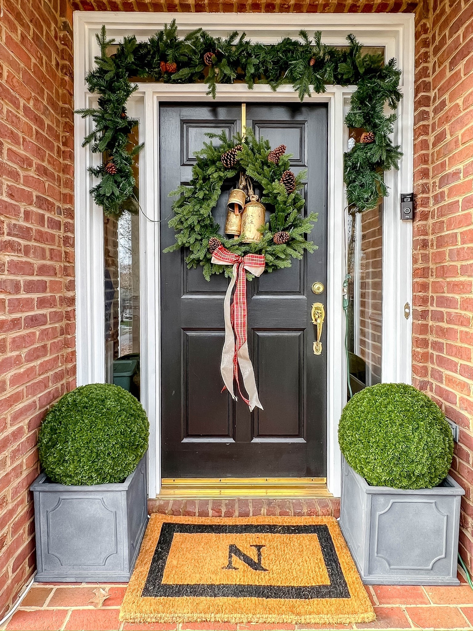 The classic elegance of a garland, wreath and boxwoods in planters adorn my front door. 



#LTKSeasonal #LTKHome #LTKHoliday