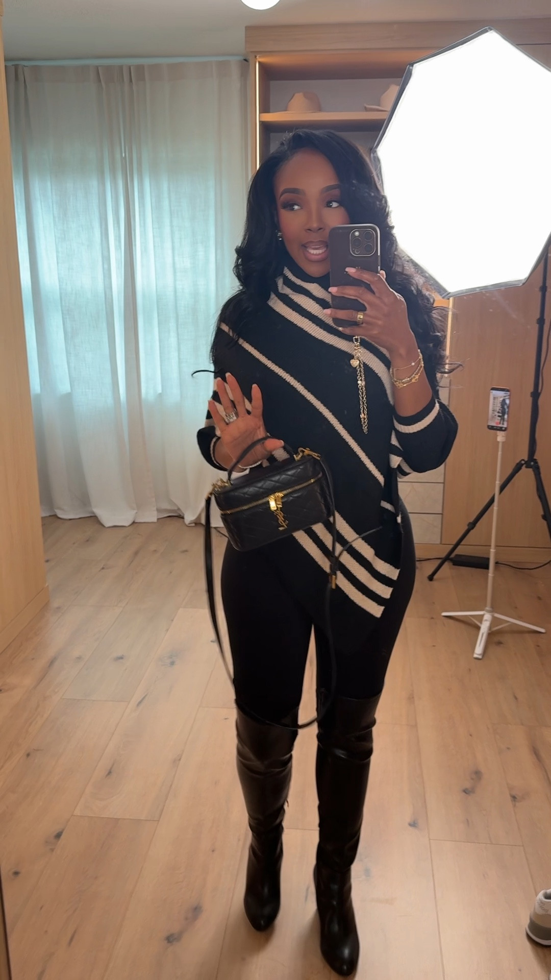 This black-and-cream striped moment is proof that a strong neutral outfit can feel bold without being loud. The diagonal stripe detail adds instant interest, while the fitted silhouette keeps everything polished and flattering. It’s one of those outfits that looks expensive, put-together, and effortless all at once.

This is a true cost-per-wear staple. Style the top with denim, trousers, or a leather skirt, and wear the boots with dresses, skirts, or jeans — the more you rewear each piece, the more the value adds up over time.

Perfect for date nights, dinner plans, girls’ night out, holiday events, or any moment you want to look chic without overthinking it.

📏 Sizing:
Top: Size Small  
Pants/Leggings: Size Small  
Boots: True to size  

📐 Measurements:
Height 5'4" | Weight 138 lbs | Bust 34D | Waist 27" | Hips 40"

Favorite this look to revisit later and tap to get all the details.

black and cream outfit, striped top outfit, chic neutral look, knee high boots outfit, elevated everyday style, fall winter outfit ideas

Follow me on Instagram and YouTube @kirasfashionfinds