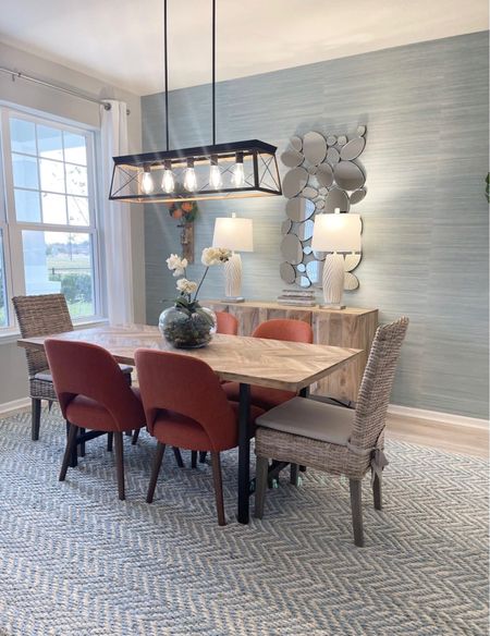 Dining room design with chandelier and Orange Chairs

#LTKhome