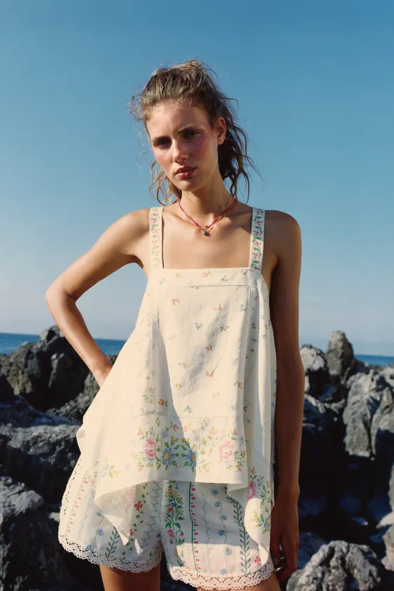 Loose-fit top made of linen. Straight neckline and wide straps. Front lace trim detail and asymme... | Zara US