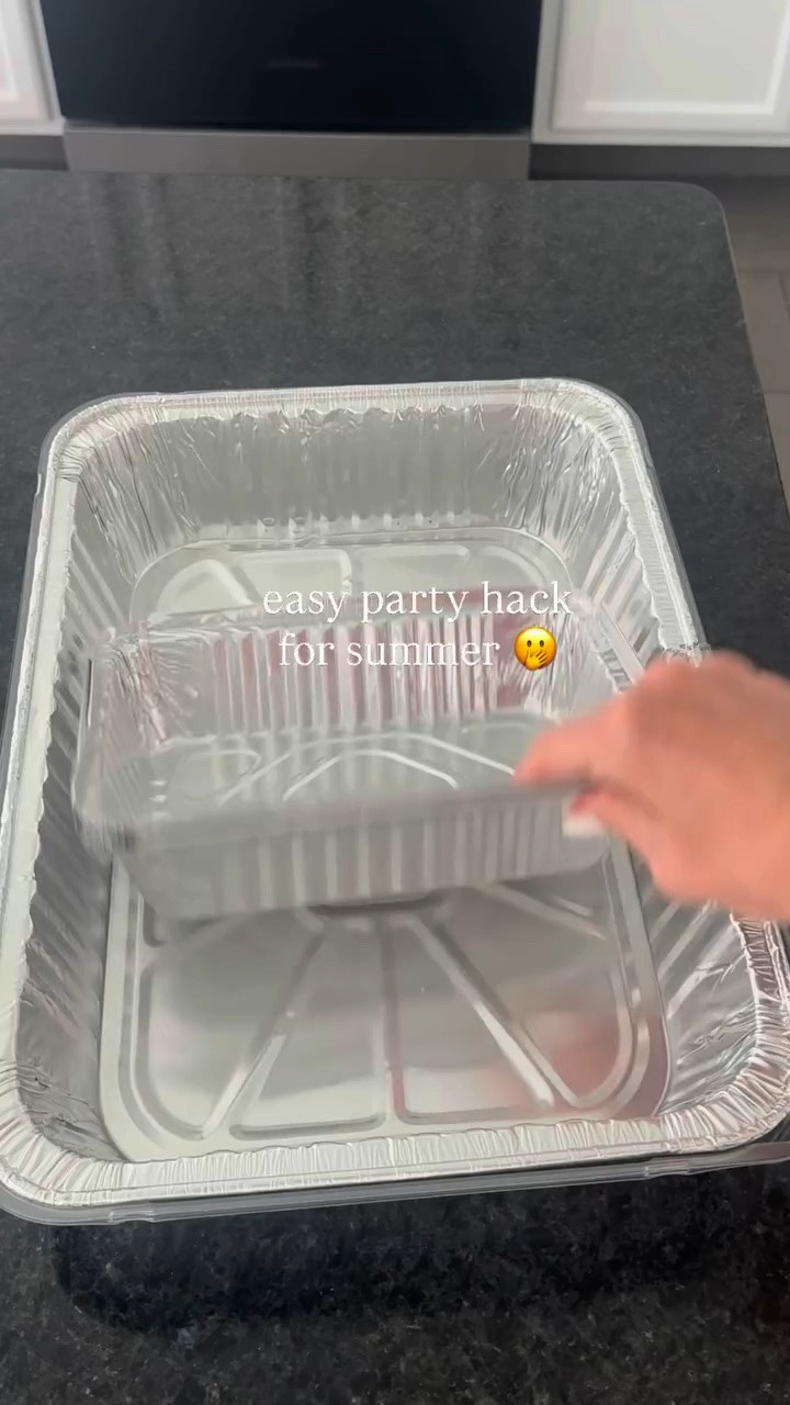 Party hack for summer hosting! 🫢🧊🍉 Freeze a large foil pan halfway with water overnight, then place your fruit + sides in smaller containers right on top so everything stays chilled. When you’re done, just toss or reuse. 👏

#summerhosting #partyhacks #hostingtips #entertainingmadeeasy #summerpartyideas
