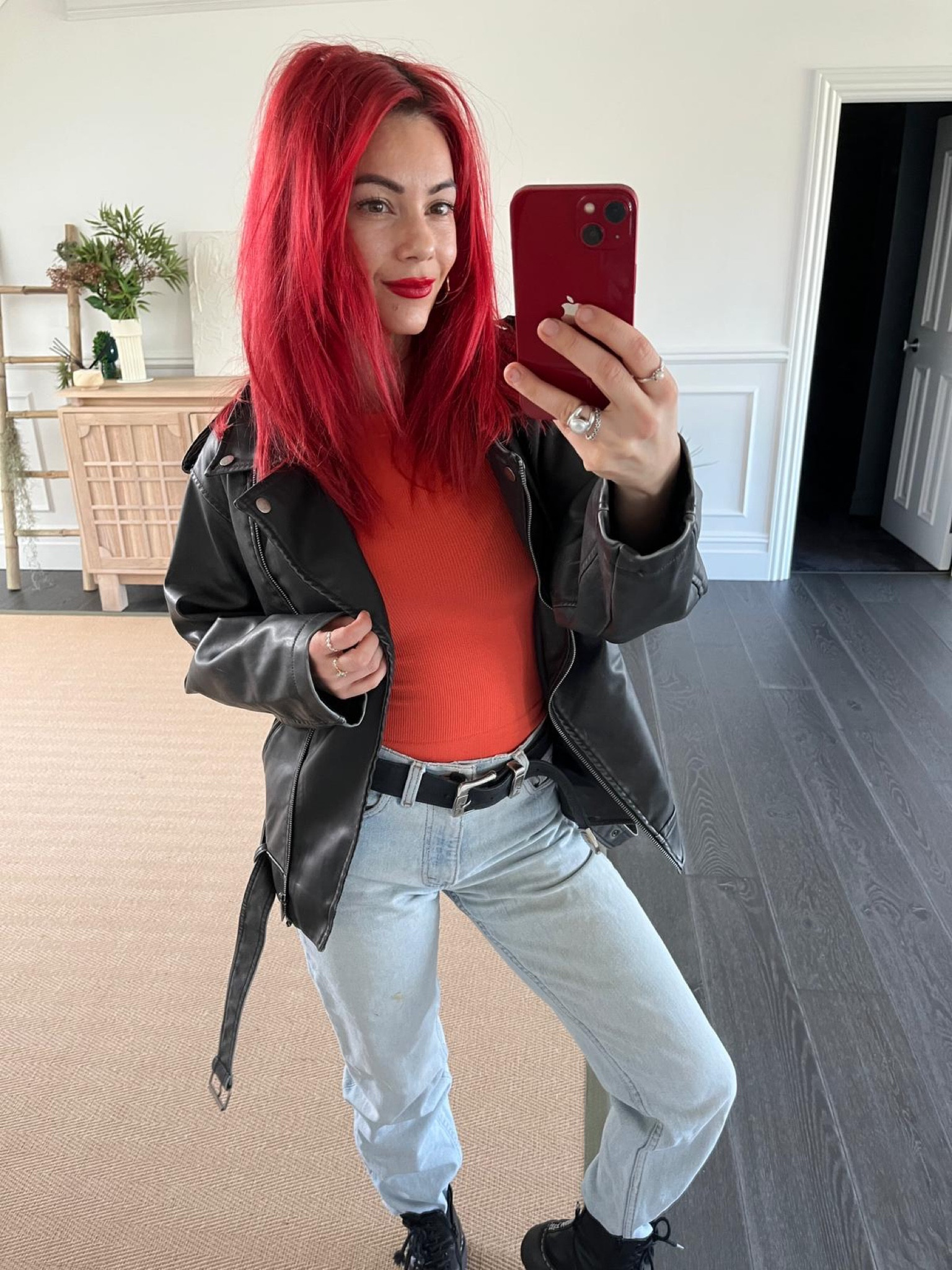 Black leather jacket, red bodysuit, light wash jeans, black combat boots

#LTKstyletip #LTKSeasonal #LTKeurope