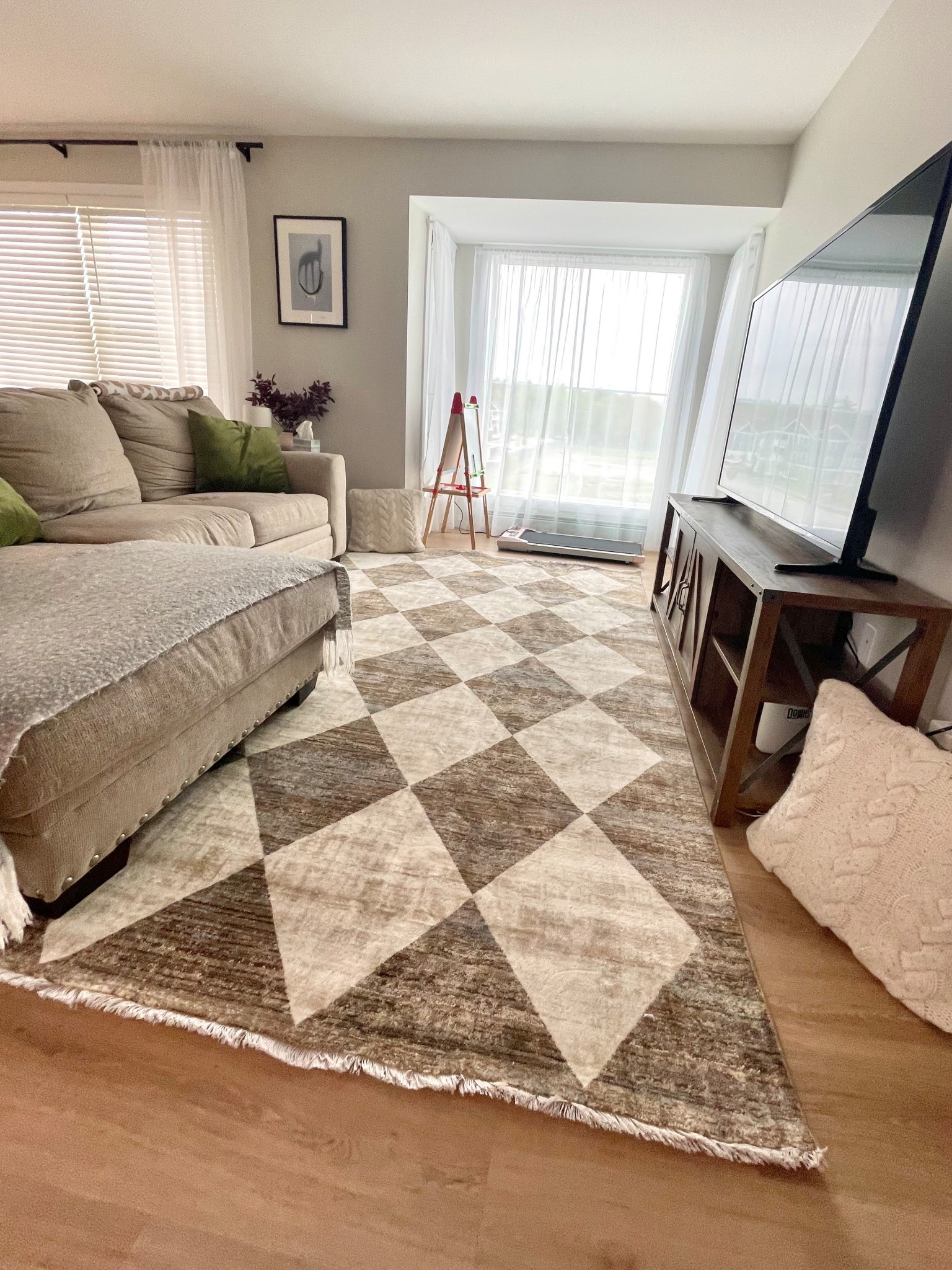 RUG ON SALE FOR $105 for the 7x10!!!!!! Beautiful new soft rug to make a cozy living room full of neutrals and green. I also got a new walking pad that is in the living room until I find it a new home 

#LTKSaleAlert #LTKActive #LTKHome