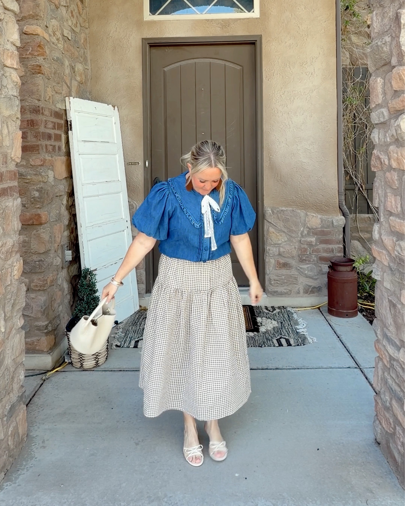 🤎cutest little spring vibe - the little bucket purse, ribbon bow and drop waist skirt…felt so cute ☺️ in this one! 
.
this exact top in denim blue is not available {linked the black version}, but I linked a similar one and you can add any ribbon to the collar {this is not attached} to make it match to anything!!! 💗 LOVE that option!
.
#denimruffles #sundayootd #dropwaist #brownginghamskirt #modestdress #springootd

#LTKOver40 #LTKPetite #LTKootd