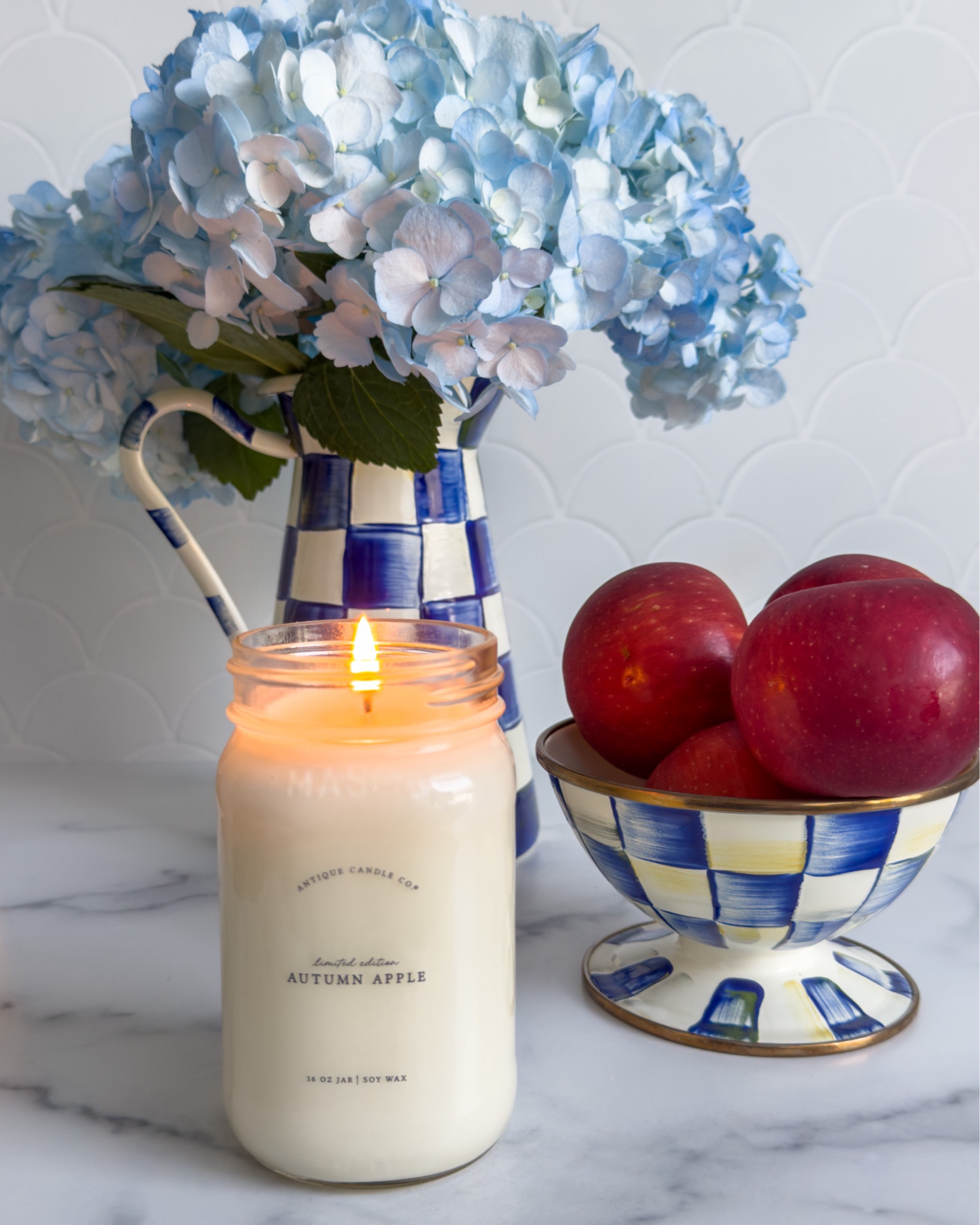 apples and hydrangeas and royal check - does it get any better ? 
#Antiquecandle #royal check #Mackenzie Childs

#LTKHome #LTKStyleTip #LTKFindsUnder50