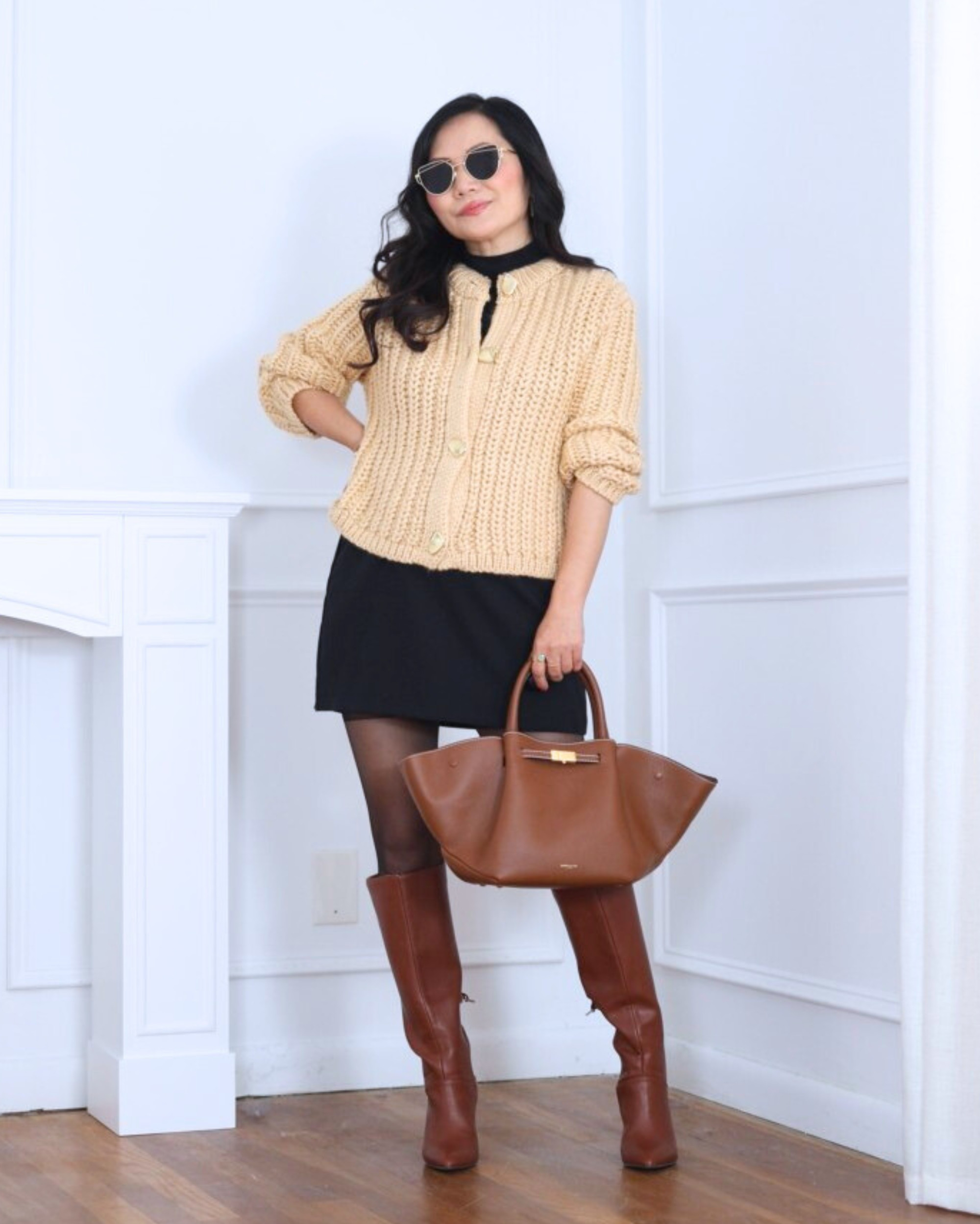 Cozy meets chic — this chunky knit cardigan from Mango paired with a black skort from Abercrombie and tall boots from Loft makes the perfect cold-weather look. Effortless, polished, and perfect for coffee dates or weekend strolls! I’m 5’2, wearing size XS.

#LTKPetite #LTKOver40 #LTKStyleTip