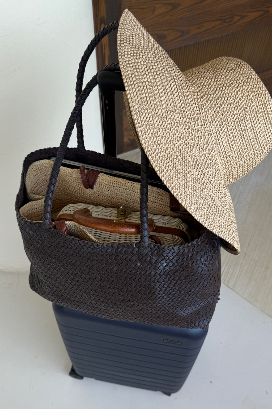 Travel bag stack - tote on sale!
• Madewell woven leather tote - lightweight and pliable, great size for petites with good capacity as a school, mom, work or travel bag. Fits my laptop easily as shown. Can even double as a pool tote 

• Eric javits scrunchie hat that holds its shape after being folded or rolled up. Great amount of shade, UPF 50 

• away the larger expandable carry on 

#LTKTravel #LTKItBag #LTKSpringSale