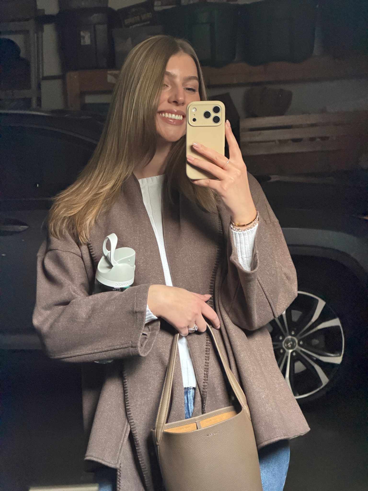 Brown light jacket, taupe leather bucket bag 

#LTKFindsUnder100